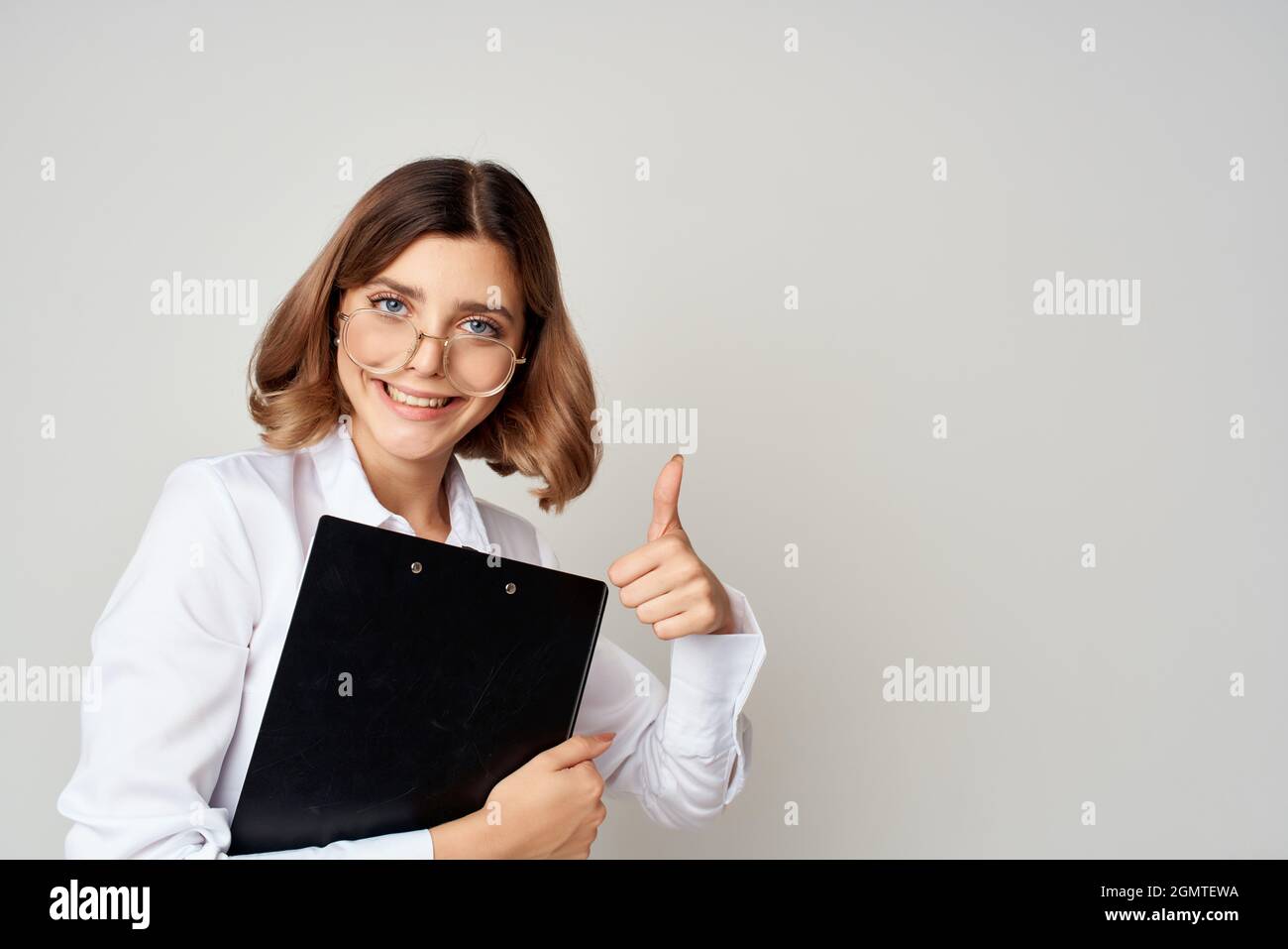 cheerful business woman in white shirt office work light background ...