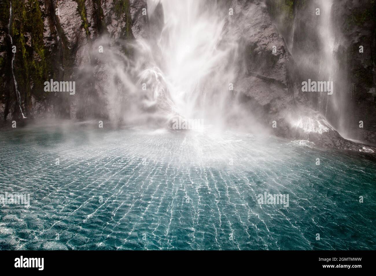 Milford Sound, New Zealand - 22 May 2012 The base of Stirling Falls in Milford Sound, New Zealand. Impact shock waves create these fascinating pattern Stock Photo