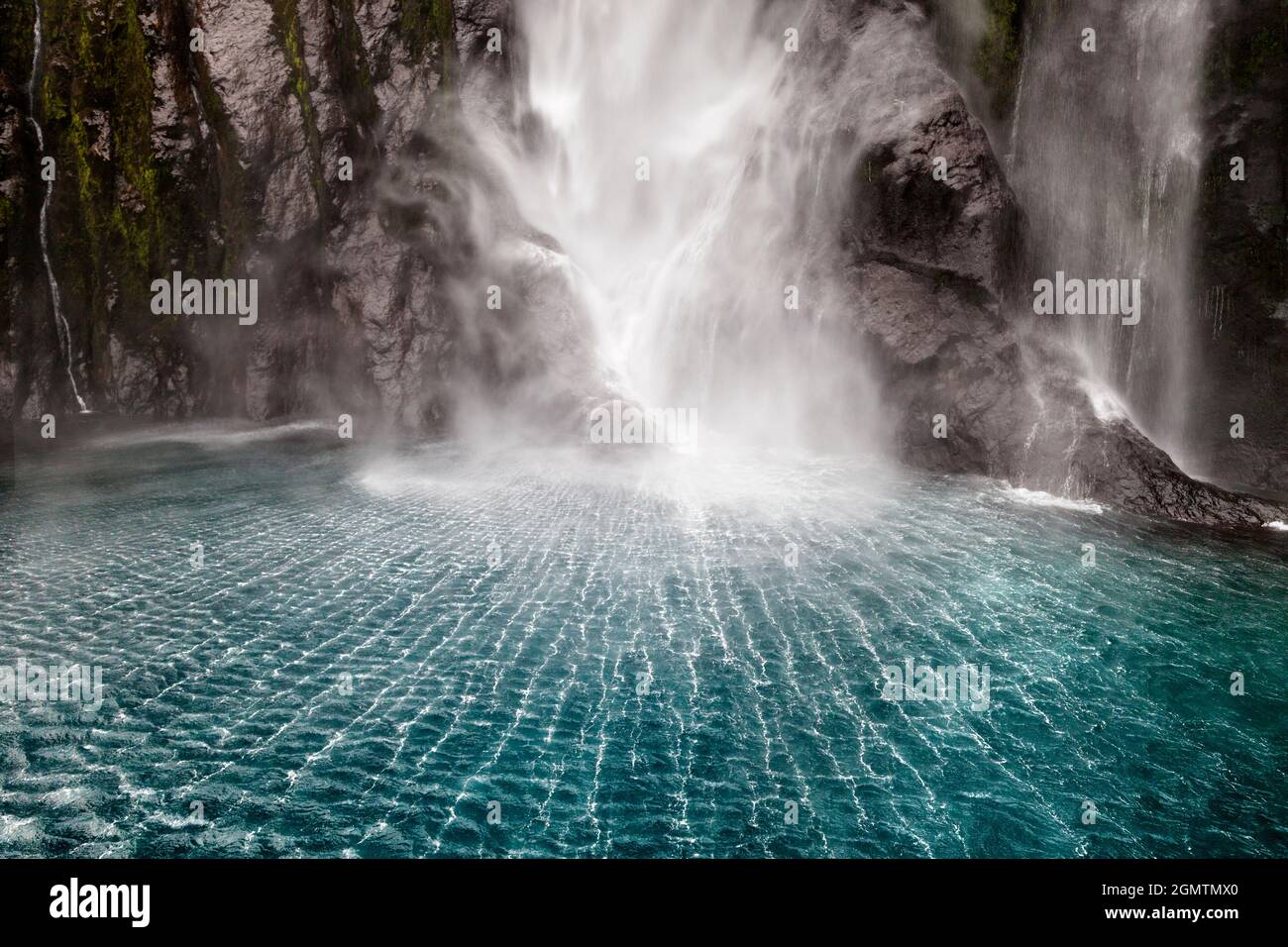 Milford Sound, New Zealand - 22 May 2012 The base of Stirling Falls in Milford Sound, New Zealand. Impact shock waves create these fascinating pattern Stock Photo