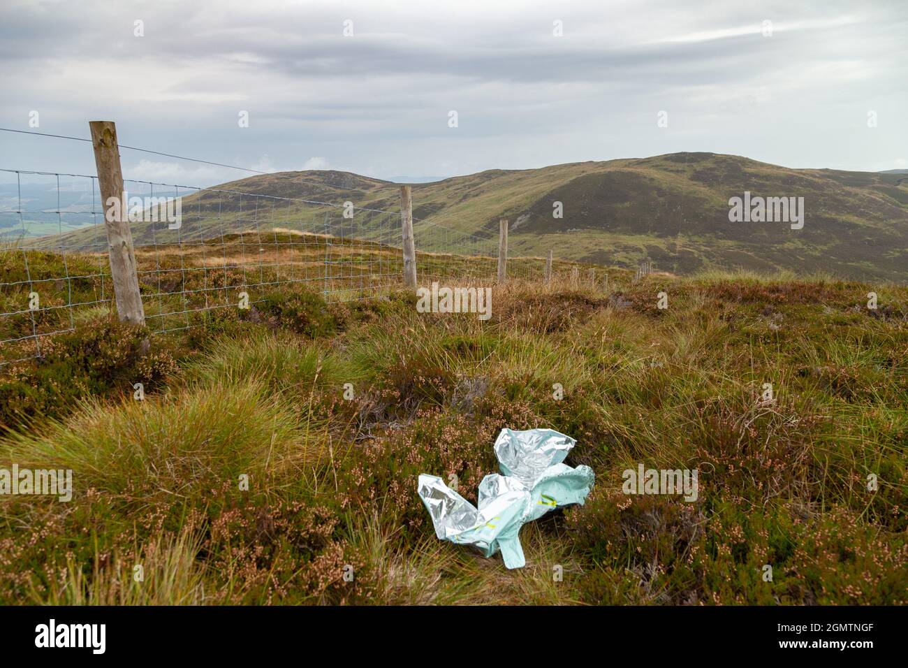 Plastic rubbis ,a ballon, on top of a remote Scottish hill Stock Photo