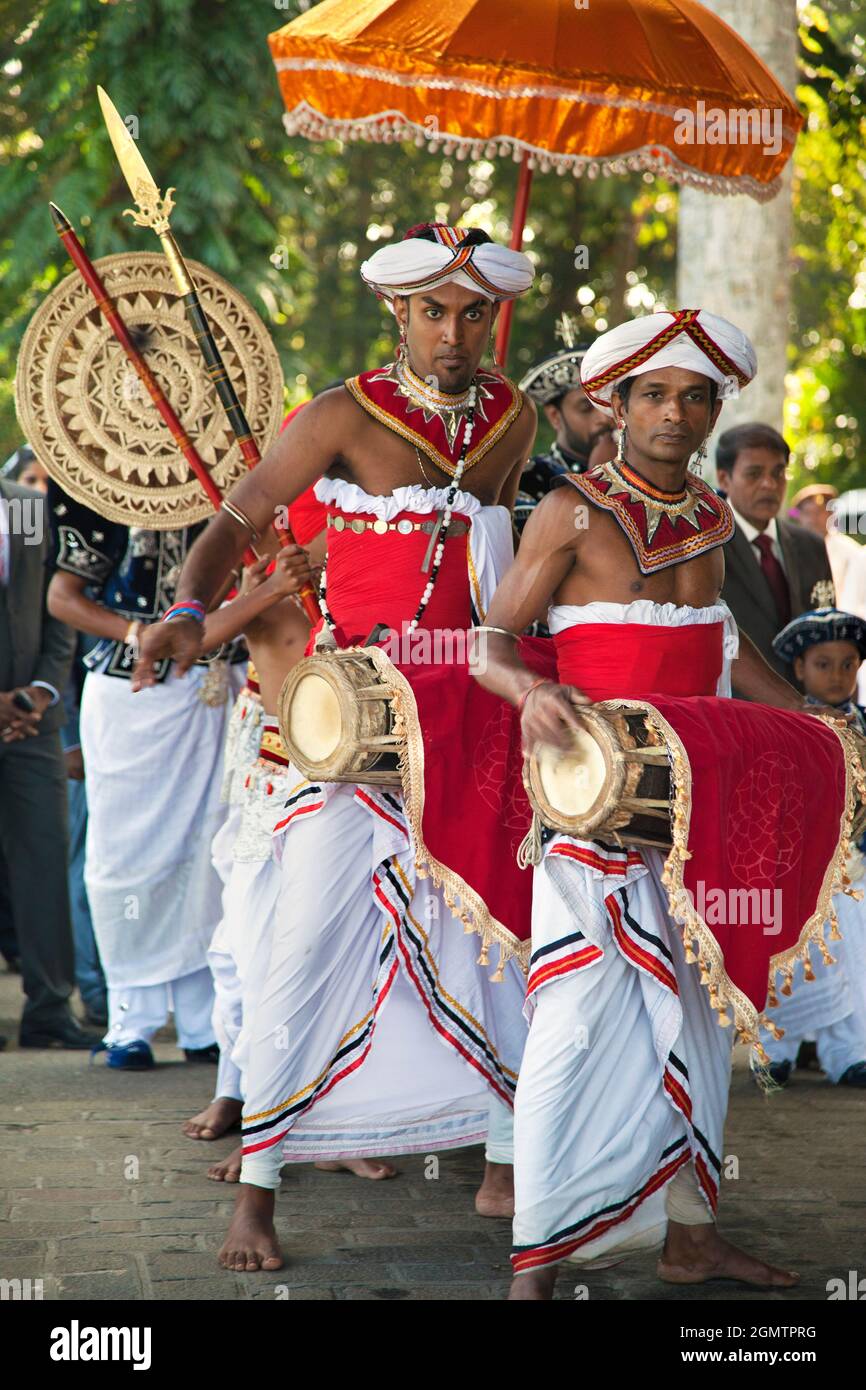 Dambulla, Sri Lanka - 12 February 2014 Traditional drummers, dancers and warriors make for a colorful - and loud! - celebration of welcome for guests. Stock Photo