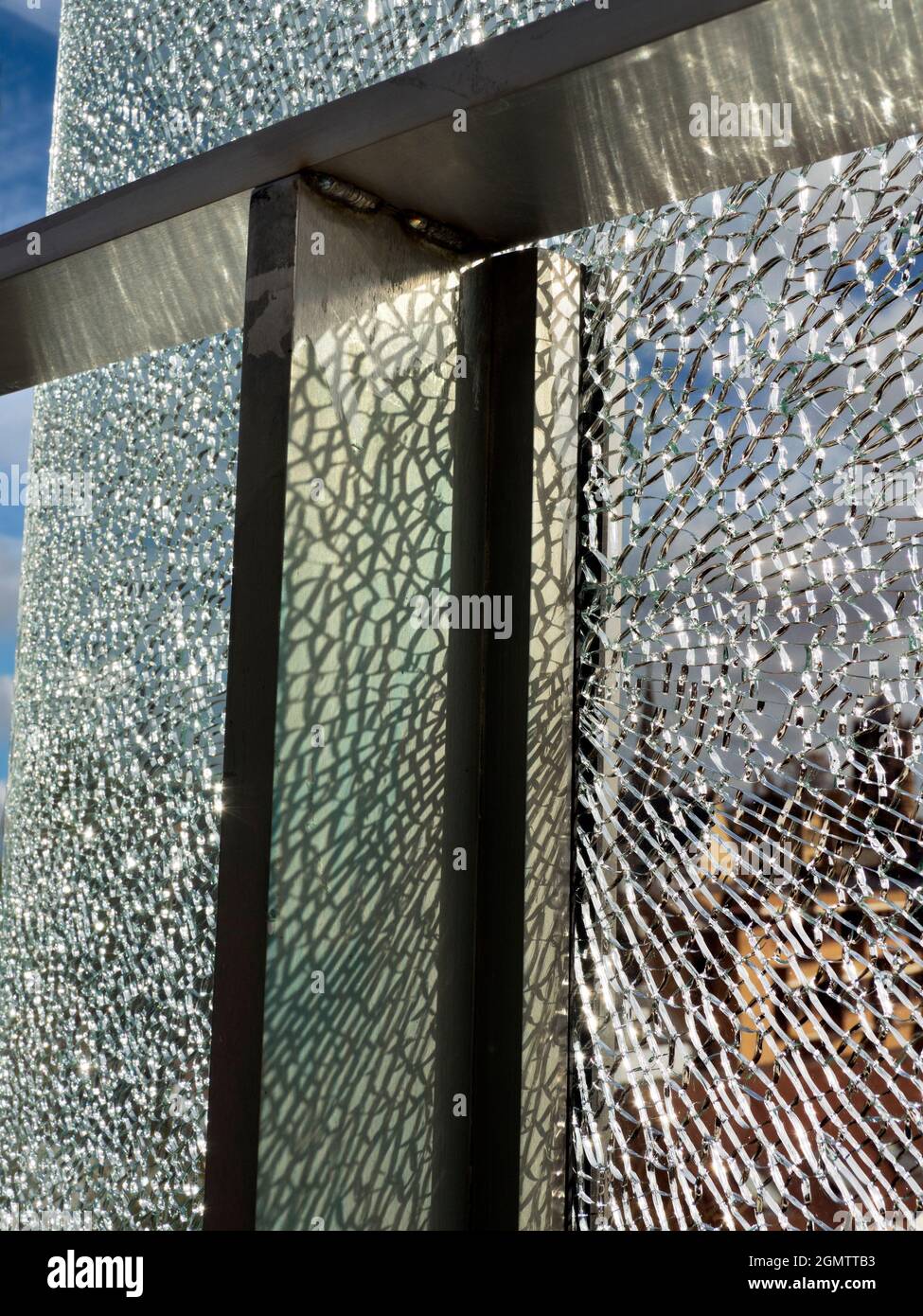 Oxford, England - 25 October 2017 A vandalised glass panel at a bus stop is a surprisingly beautiful thing, with striking abstract patterning. Stock Photo