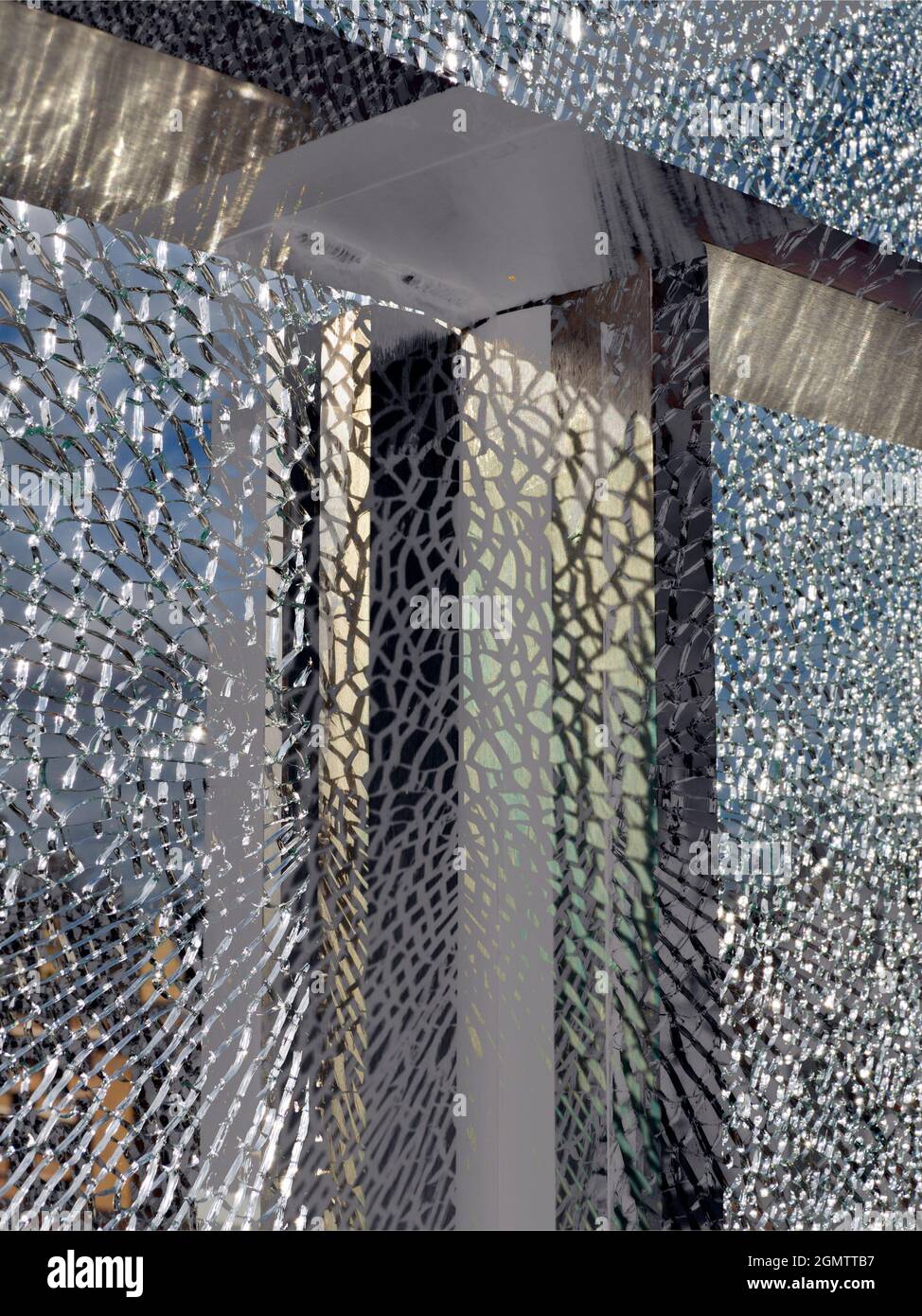 Oxford, England - 8 November 2017 A vandalised glass panel at a bus stop is a surprisingly beautiful thing, with striking abstract patterning. Stock Photo