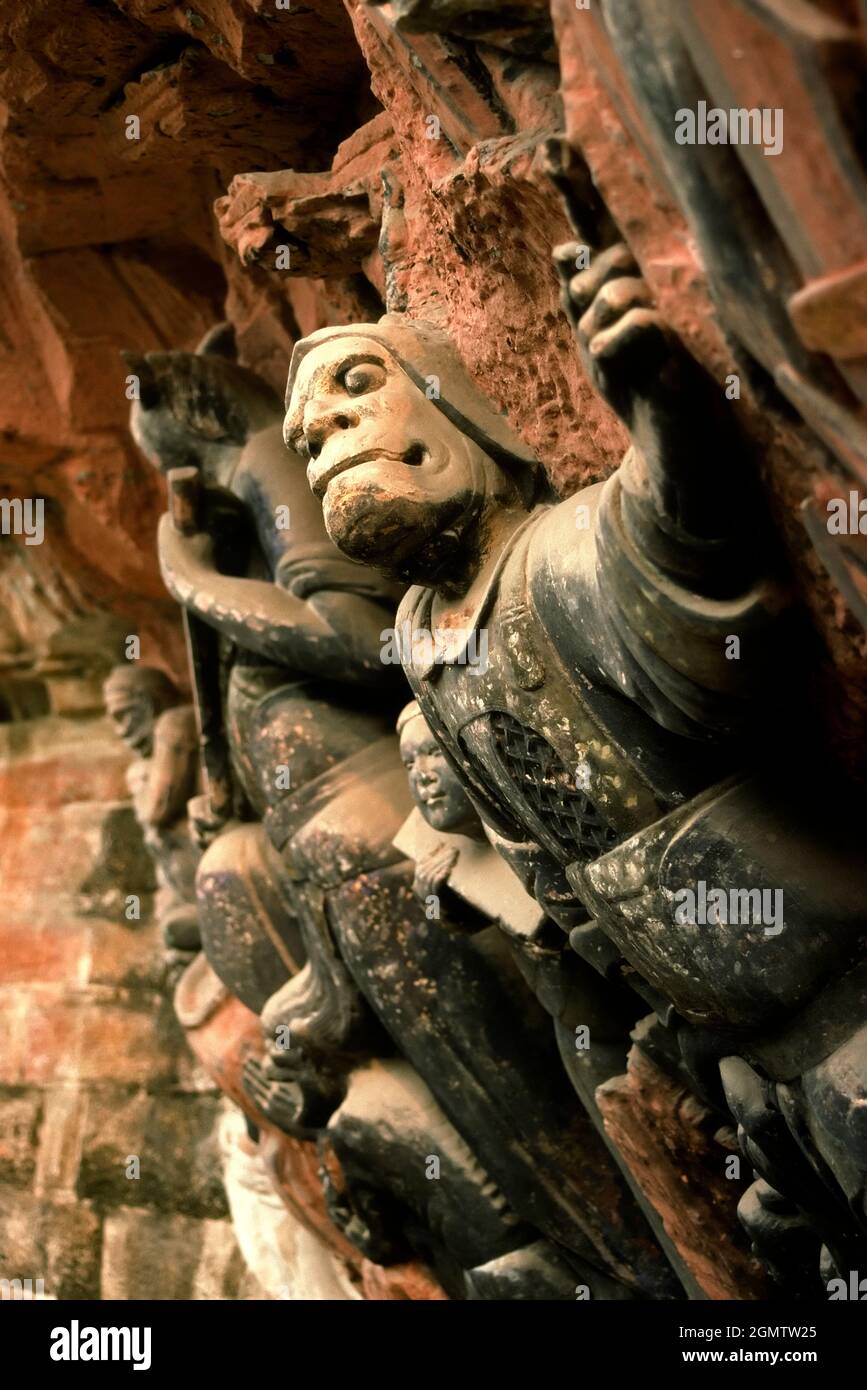 Chongqing, Sichuan, China - December 1997 The spectacular Dazu Rock Carvings in Sichuan are a diverse series of Chinese religious sculptures and carvi Stock Photo