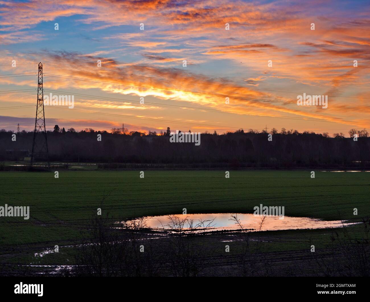 Radley Village, Oxfordshire, UK - 31 January 2021; No people in view.     I love electricity pylons; I find their abstract, gaunt shapes endlessly fas Stock Photo