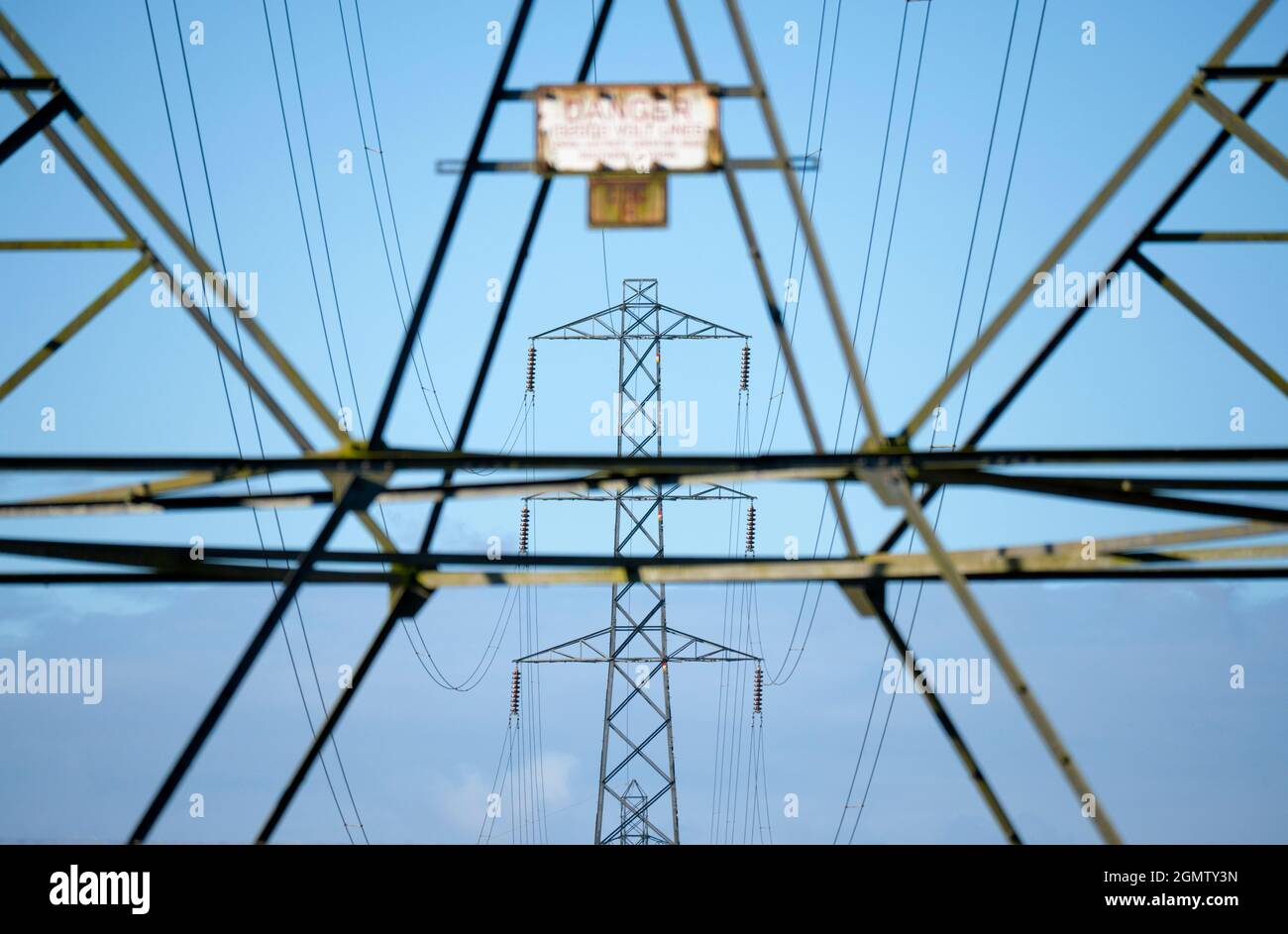 Oxfordshire, England - 28 July 2020; no people in view.    I love electricity pylons; I find their abstract, gaunt shapes endlessly fascinating. Here Stock Photo