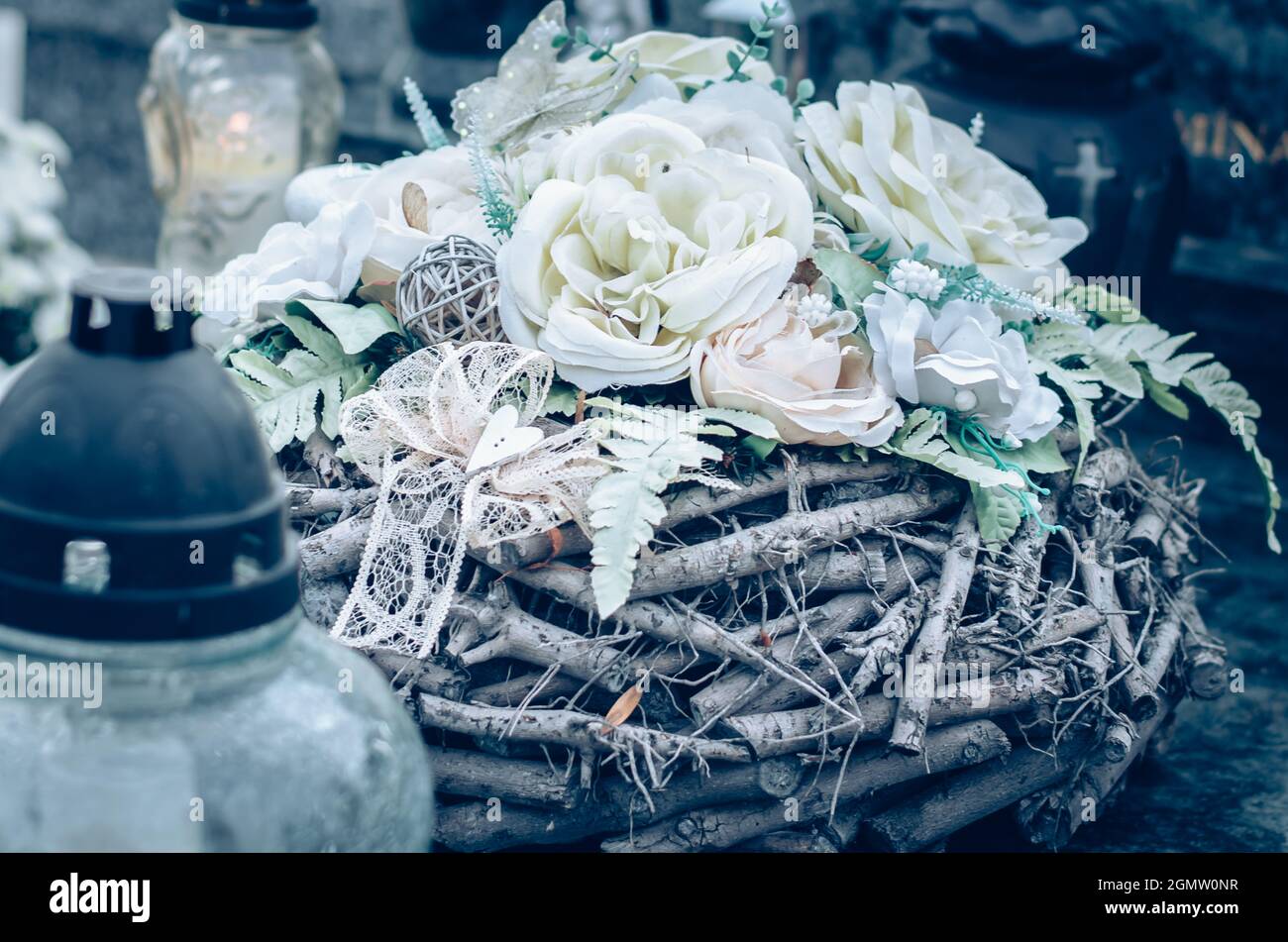 colorful symbolic decoration of flowers on graves in cemetery during