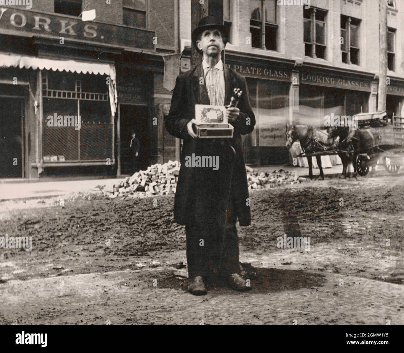 Jacob Riis photography A Blind Beggar A man stands alone appearing