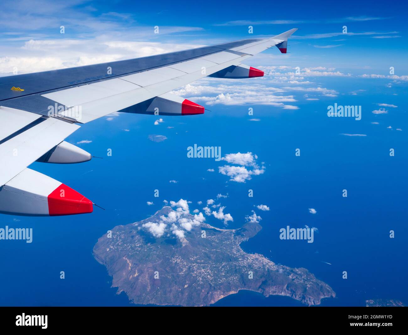 In flight - 26 September 2019    We're returning from Sicily to London. Here is what we can see from the airplane porthole, flying above the azure Med Stock Photo