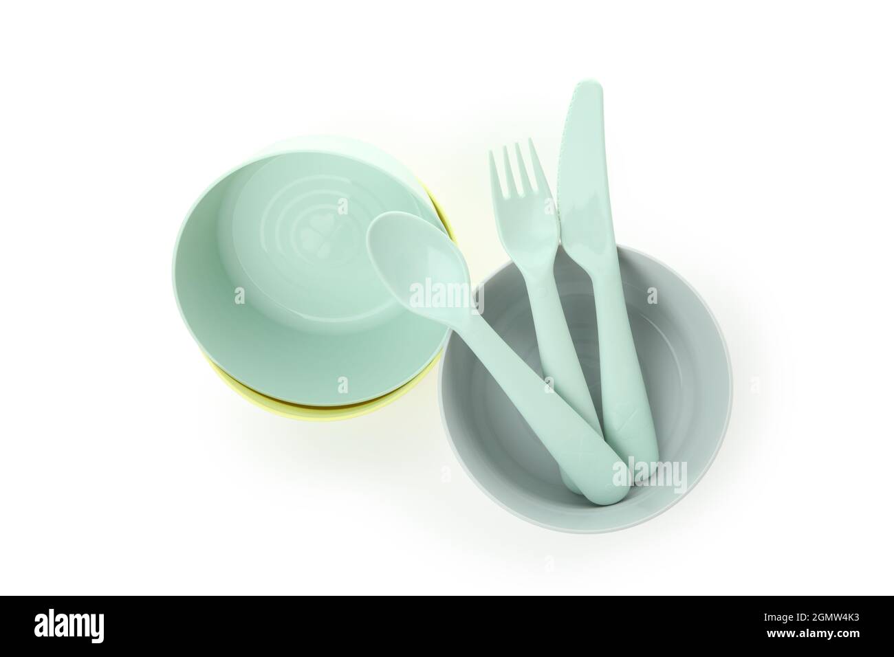 Colorful plastic dishware isolated on white background Stock Photo