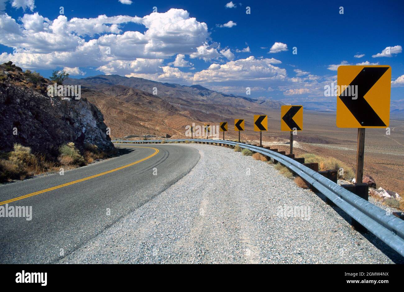 Death Valley, California - October 1985; Deserted, searing hot highway in Death Valley, close to the iconic Zabriskie Point. Stock Photo