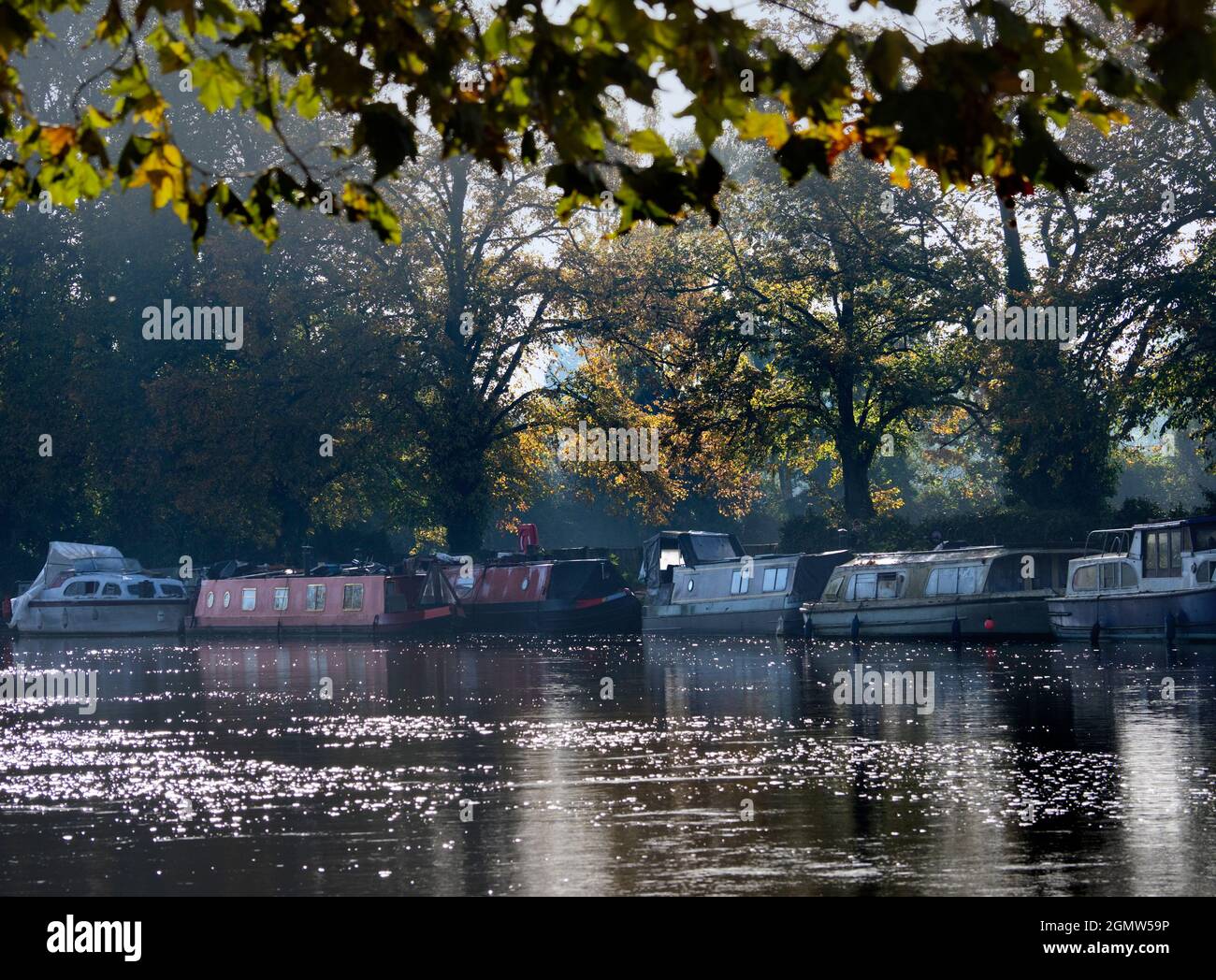 Oxford, England -  2011;  Oxford's waterways, canals, streams and rivers are a source of many tranquil, scenic delights. Here we see houseboats moored Stock Photo