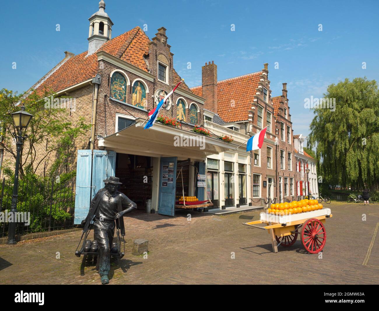 Edam, the Netherlands - 27 May 2016;  Cheese lovers, rejoice! A cheese shop, a pile of cheese and a cheesy sculpture, all in a city named after a chee Stock Photo