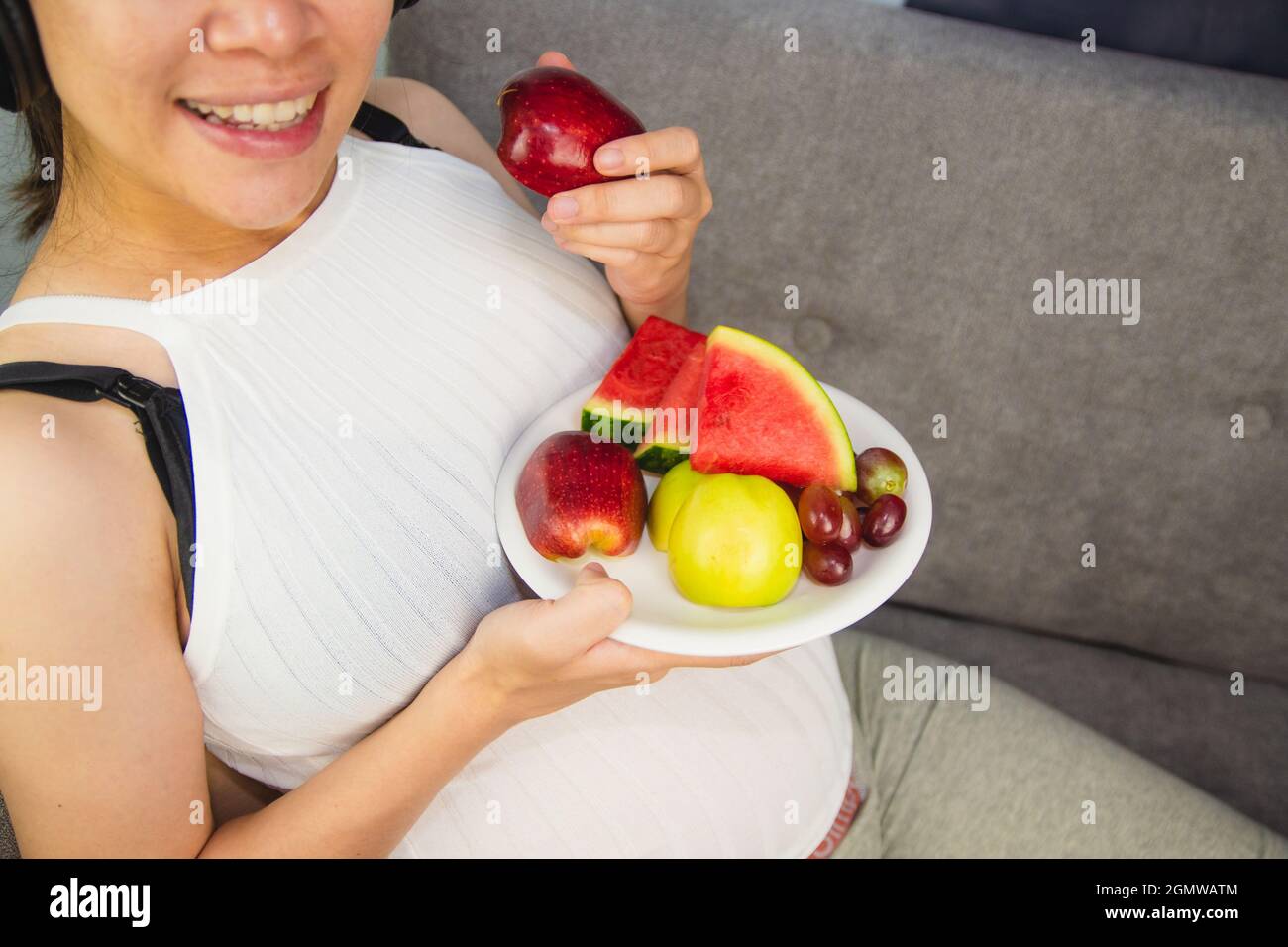pregnant woman eat fruit watermelon apple grape Stock Photo Alamy
