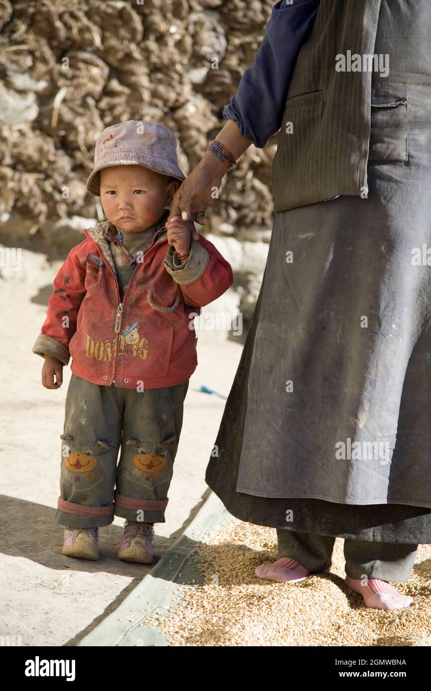 Tibetan child holding hands hi-res stock photography and images - Alamy