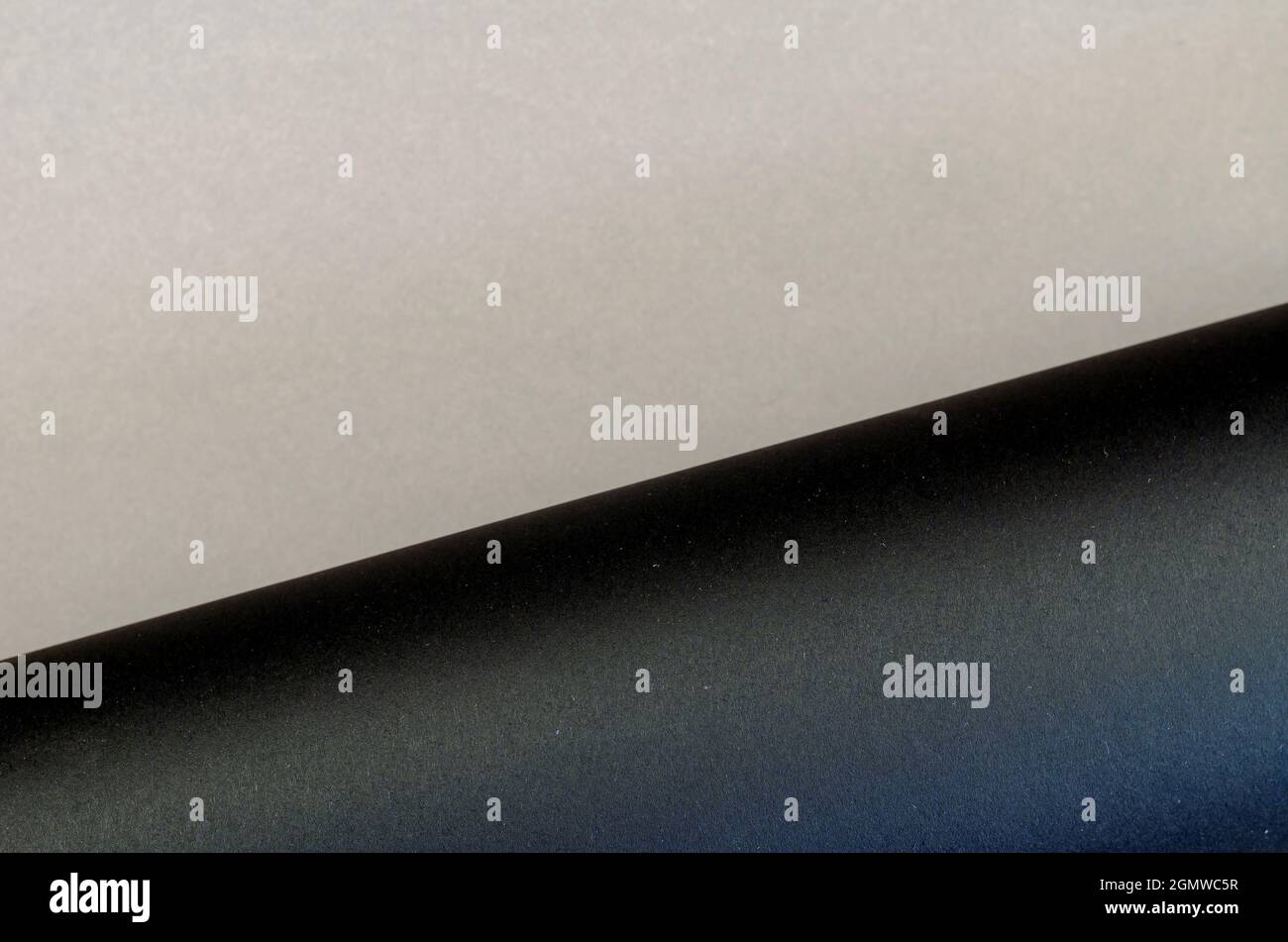 Two-color multitasking background. Gray-black surface. Top view. Stock Photo