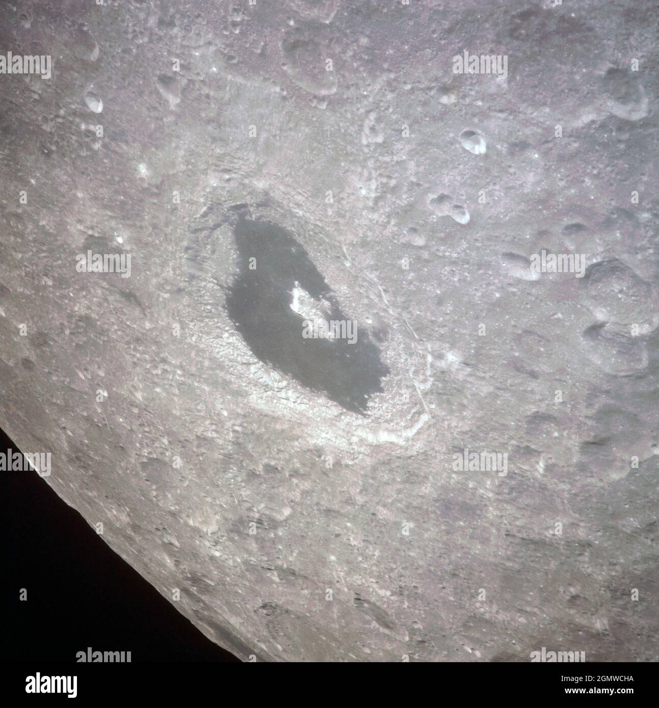 (14 April 1970) --- Excellent view of the lunar farside showing the crater Tsiolkovsky, as photographed by the crew of the Apollo 13 mission during their lunar pass. The view is looking southeast toward the lunar horizon. The approximate coordinates of Tsiolkovsky are 128.5 degrees east longitude and 20.5 degrees south latitude. The Apollo 13 crew members were forced to cancel their scheduled lunar landing because of an apparent explosion of oxygen tank number two in the Service Module (SM) Stock Photo