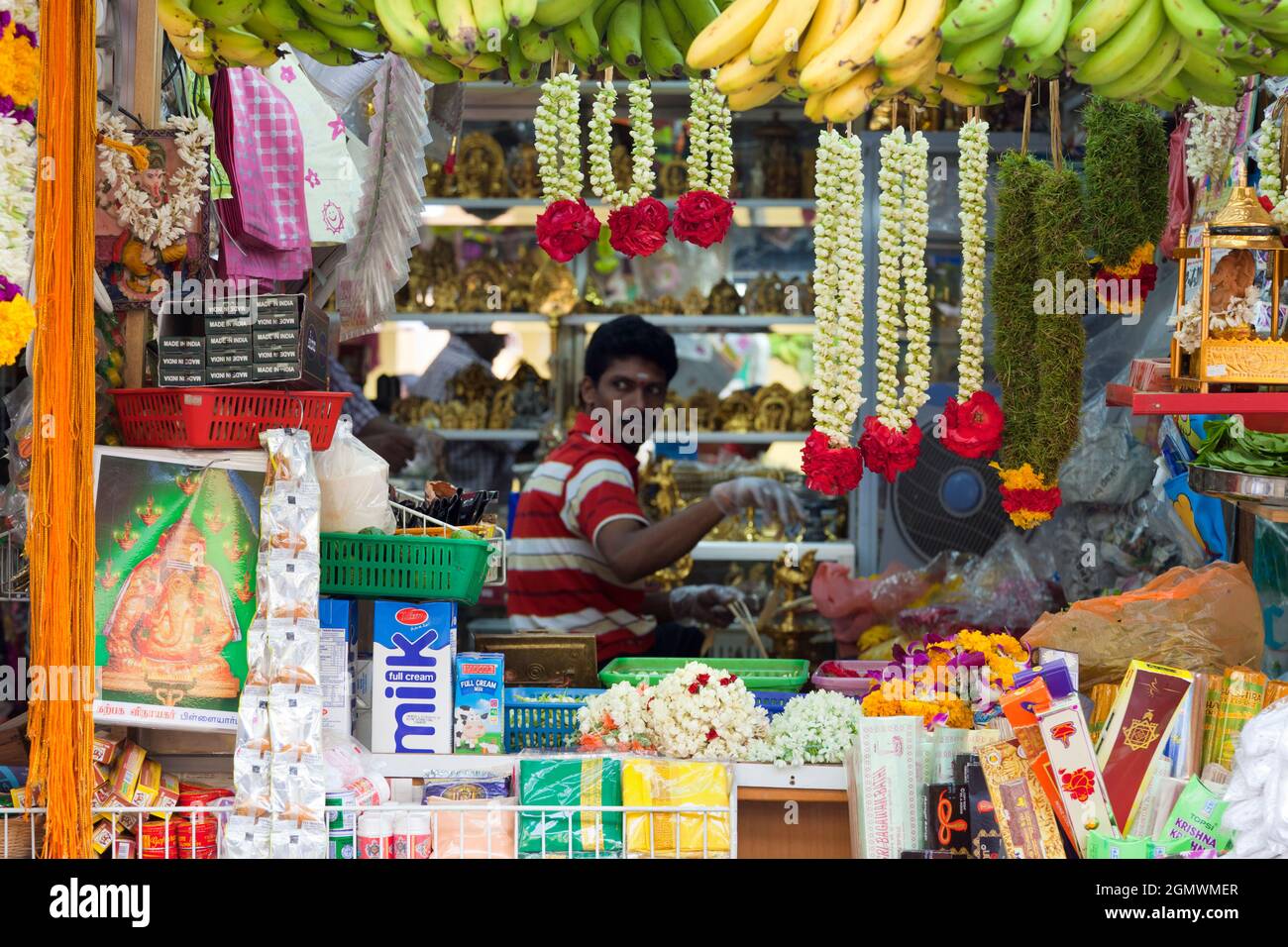 This stall in Little India sells garlands and incense and is conveniently located close to Singapore's much-loved Sri Mariamman Hindu Temple. Stock Photo