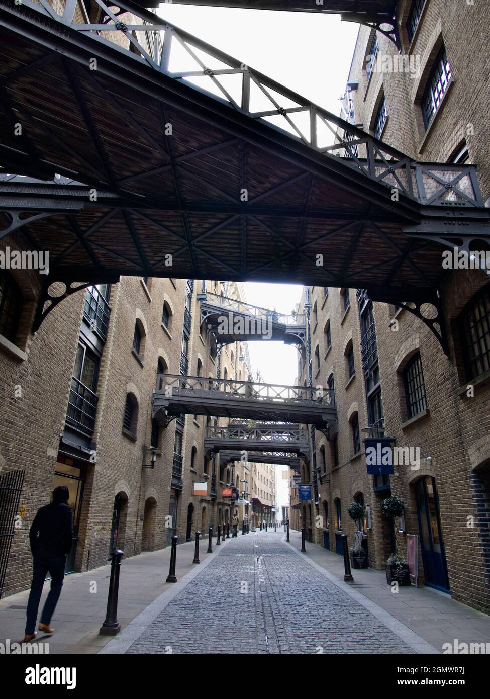 Shad Thames is now the best surviving example of a type of commercial street that was common in London Dockland before its gentrification and developm Stock Photo