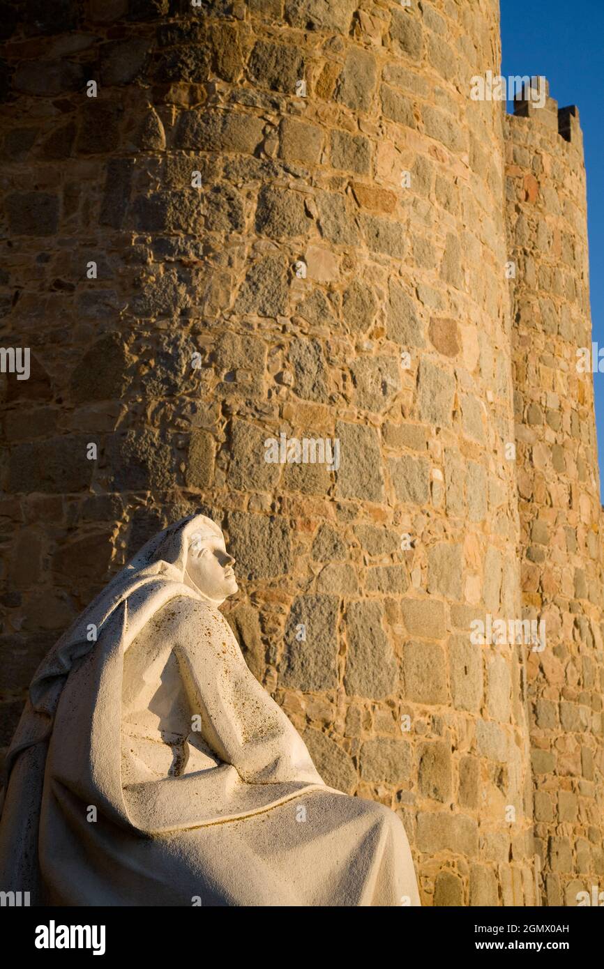 Statue of Saint Teresa outside the walls of Ávila, Spain 2Ávila, Spain - 20 September 2008; no people in view. The intact - and seriously thick - ston Stock Photo