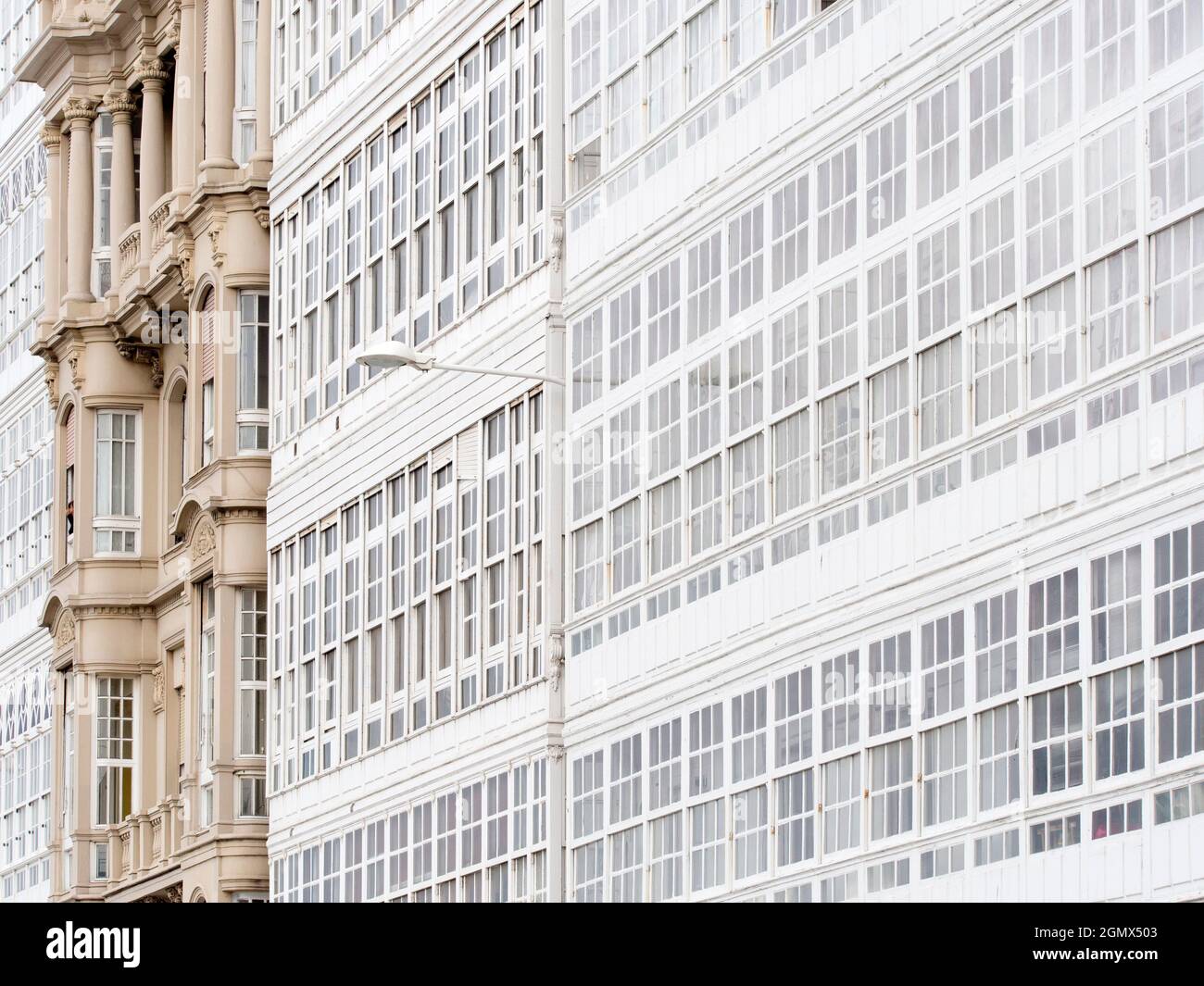 La Coruna, Spain - 10 October 2015; no people in view. Glass-enclosed balconies, or galerias, are a very distinct architectural style of La Coruna in Stock Photo