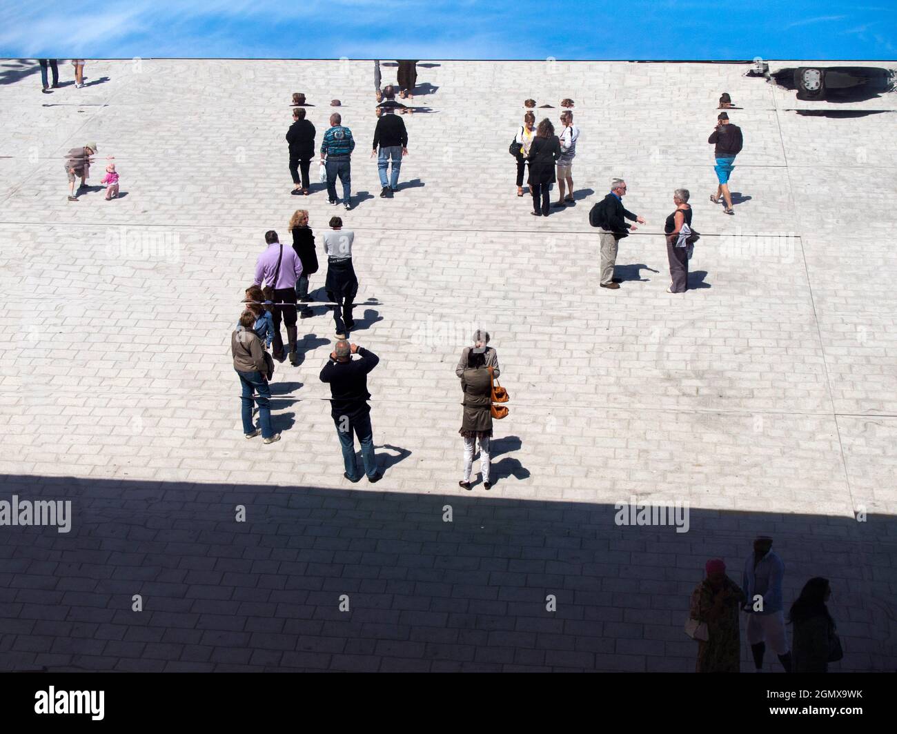 Marseilles, France - 20 June 2013; Lots of people in view, but upside down.The Ombriere in Marseilles Old Port is a blade of reflective stainless stee Stock Photo