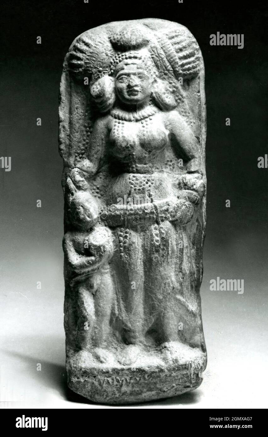 Plaque with Goddess and Attendant. Period: Shunga period; Date: ca. 100 B.C; Culture: India; Medium: Terracotta; Dimensions: 6 1/4 x 2 1/4 in. (15.9 Stock Photo