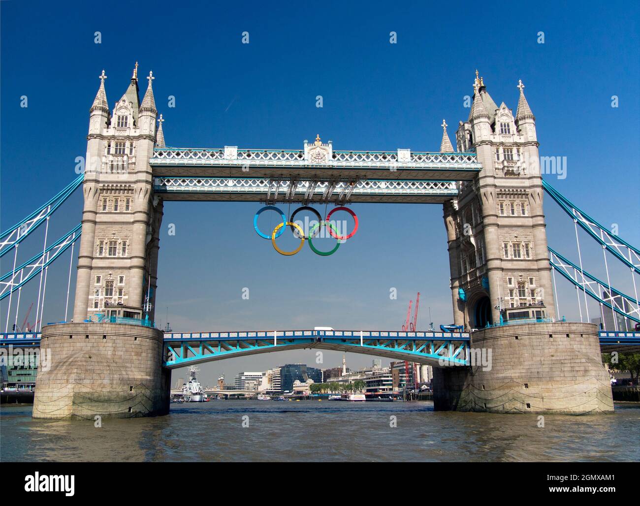 Tower Bridge, shown here on a fine summer day just before the London Olympic Games of 2012, is a much-loved suspension bridge located in the heart of Stock Photo