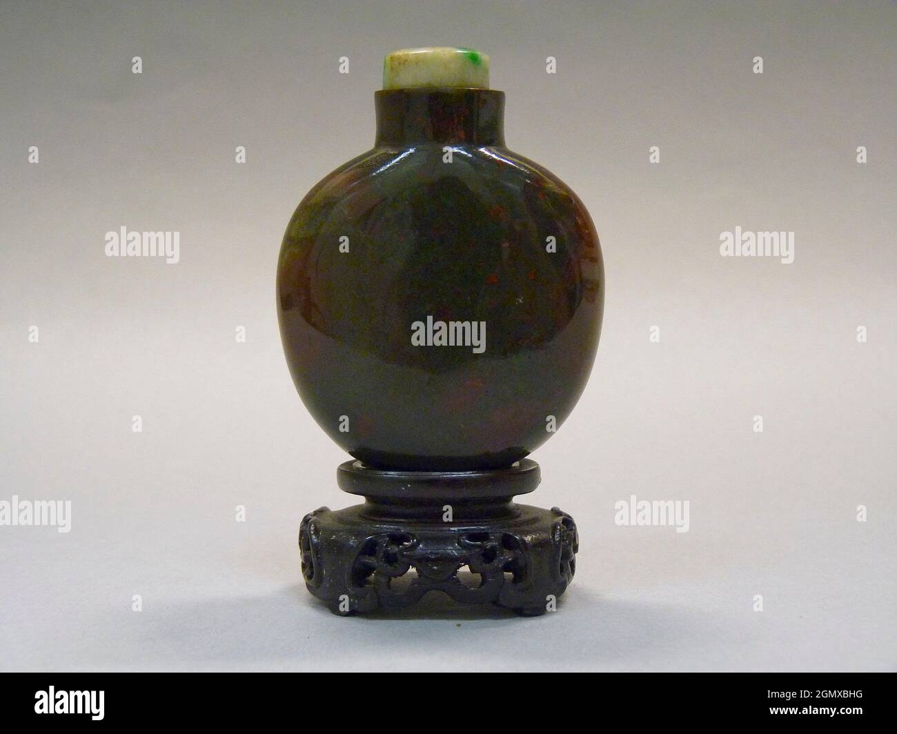 Snuff Bottle. Period: Qing dynasty (1644-1911), Qianlong period (1736-95); Culture: China; Medium: Bloodstone agate with jadeite stopper; Dimensions: Stock Photo
