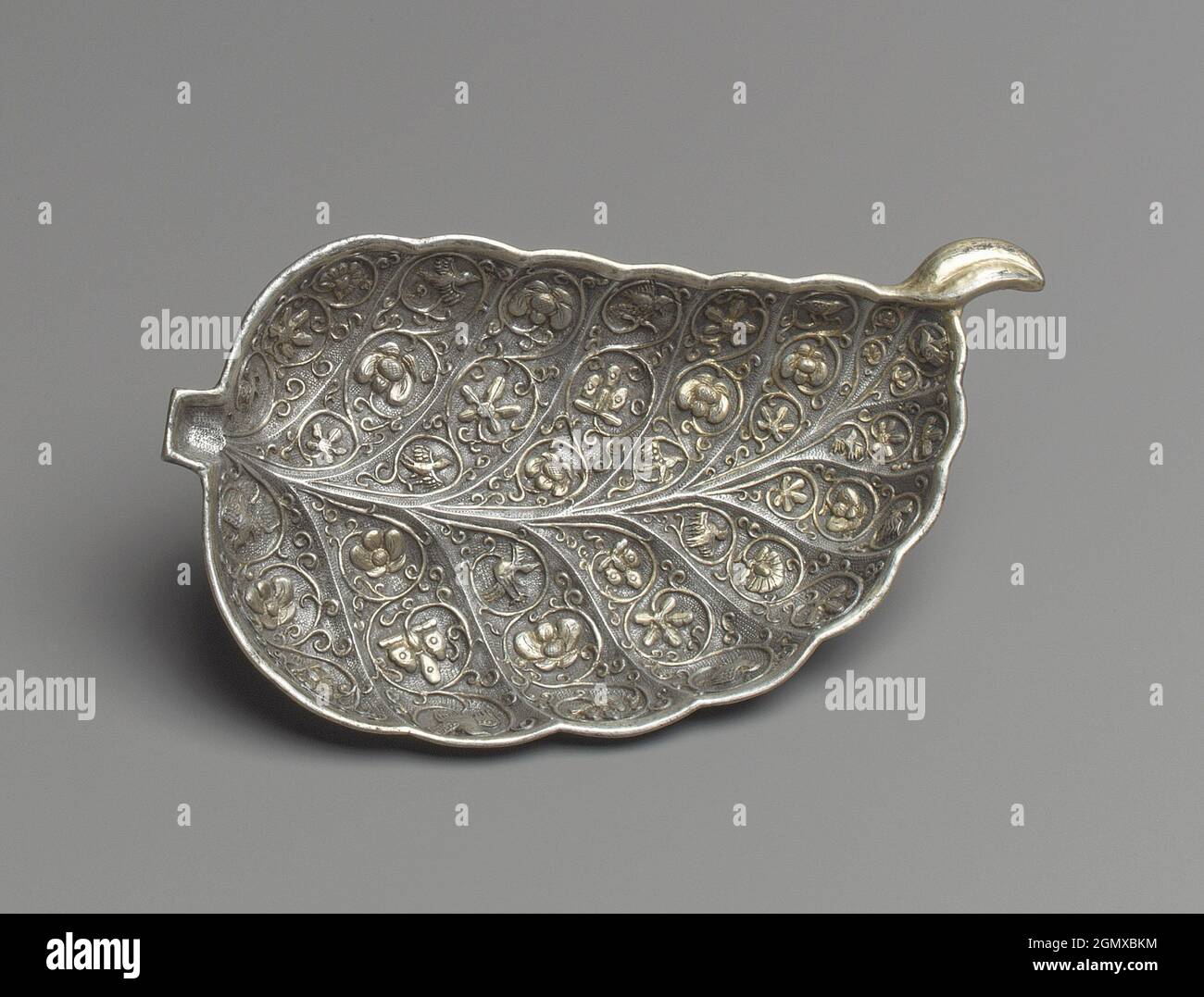 Dish in the Shape of a Leaf. Period: Tang dynasty (618-907); Date: late 7th-early 8th century; Culture: China; Medium: Silver with parcel gilding; Stock Photo