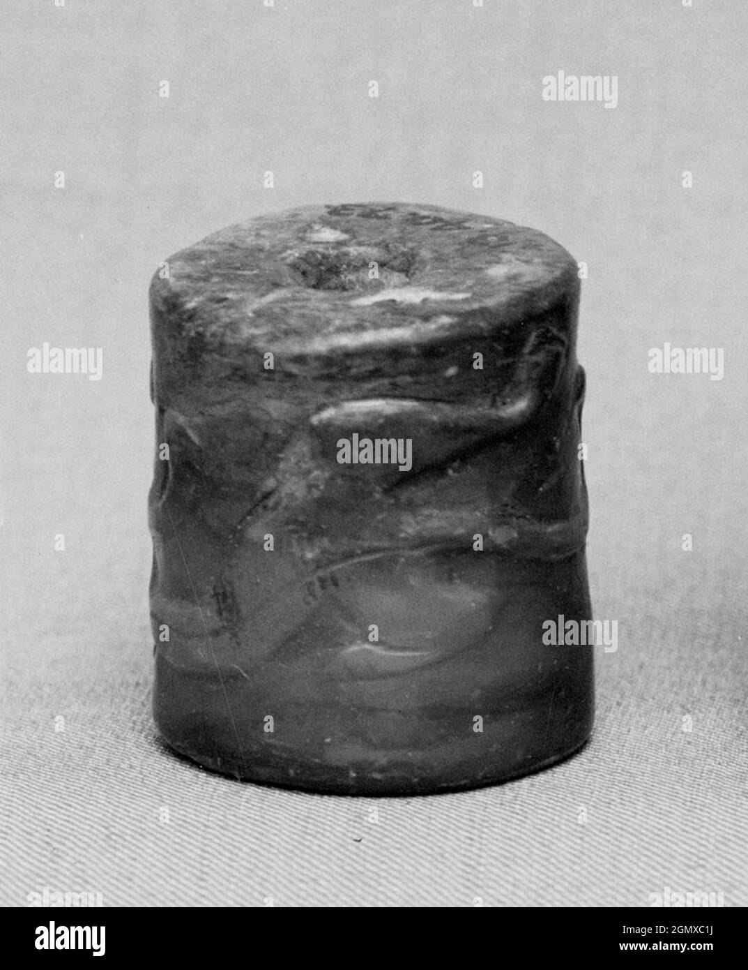 Bead. Period: Han dynasty (206 B.C.-A.D. 220); Culture: China; Medium: Jade; Dimensions: H. 13/16 in. (2.1 cm); Diam. 5/8 in. (1.6 cm); Stock Photo