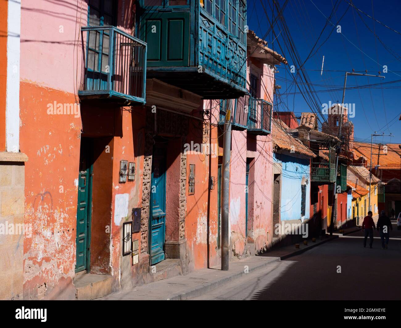 Potosi, Bolivia - 22 May 2018; two silhouetted people in street    Potosi and its history are inextricably linked with silver. One of the highest citi Stock Photo