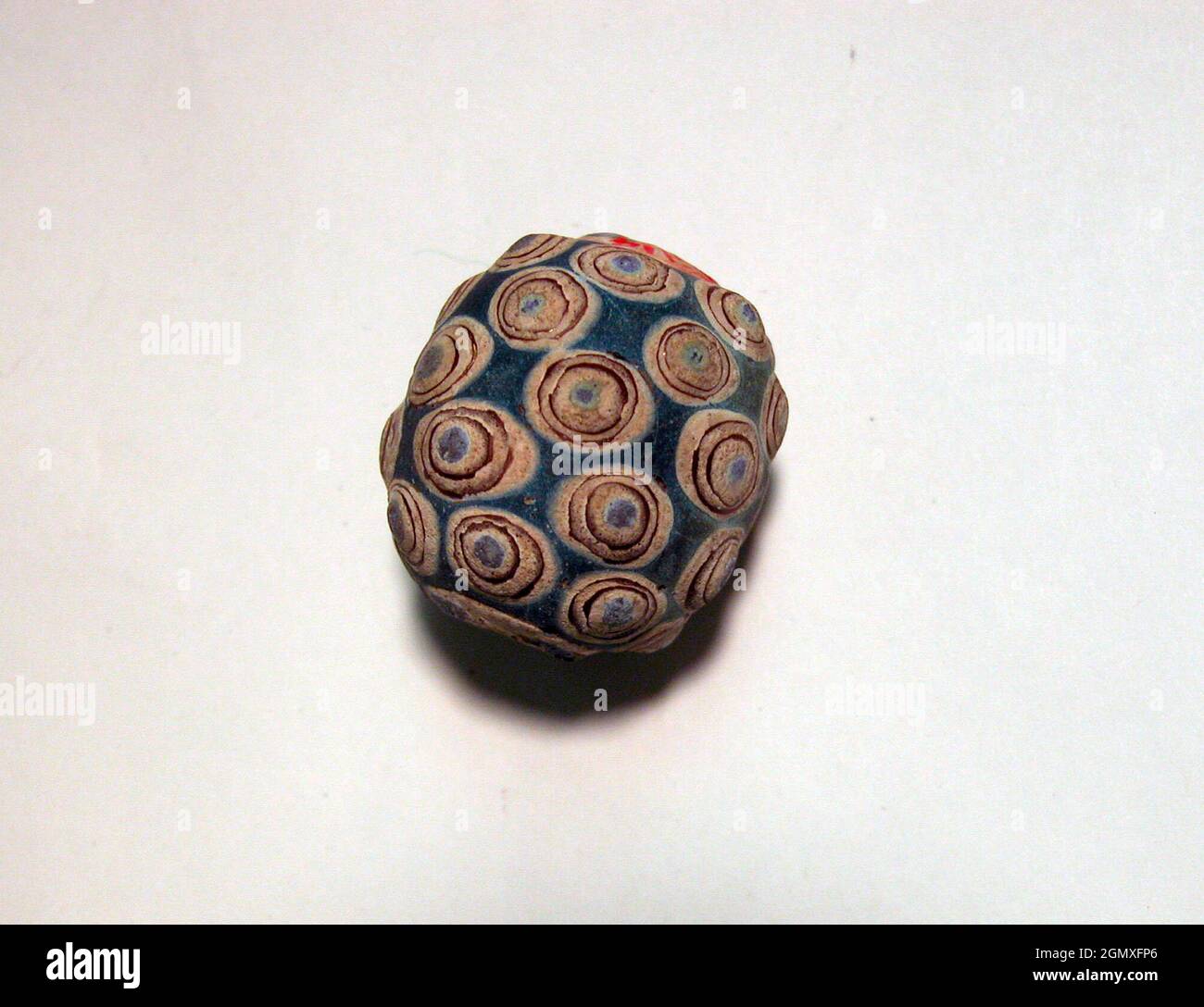 æ±á¨æ-™ç /Bead. Period: Eastern Zhou dynasty (770-256 B.C.); Culture: China; Medium: Glass paste over ceramic core; Dimensions: H. 1 1/8 in. (2.8 Stock Photo