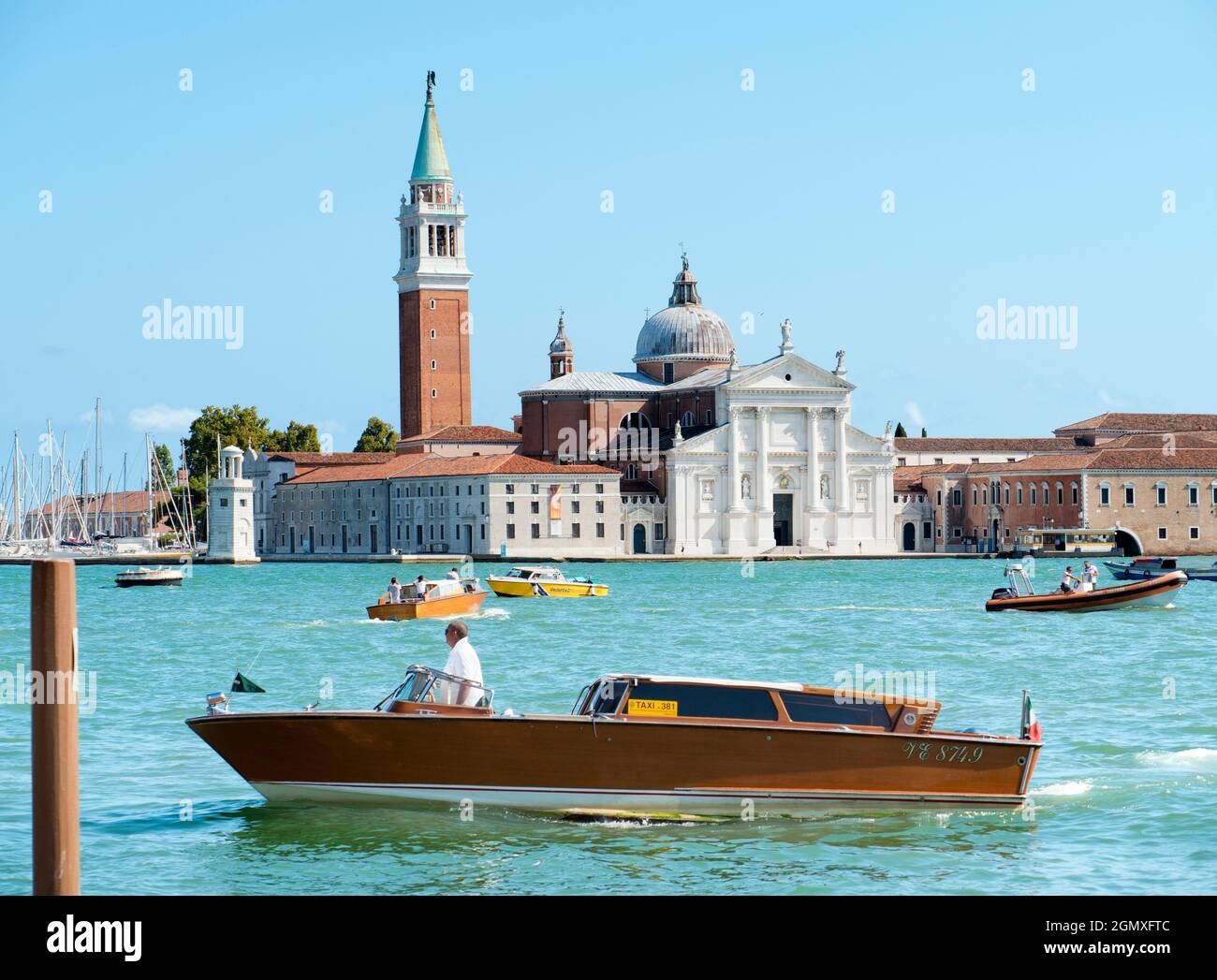 Venice, Italy - 5 September 2017; several people on boats are in-shot. Venice is one of the great cities of the world, famed for its canals, sublime a Stock Photo