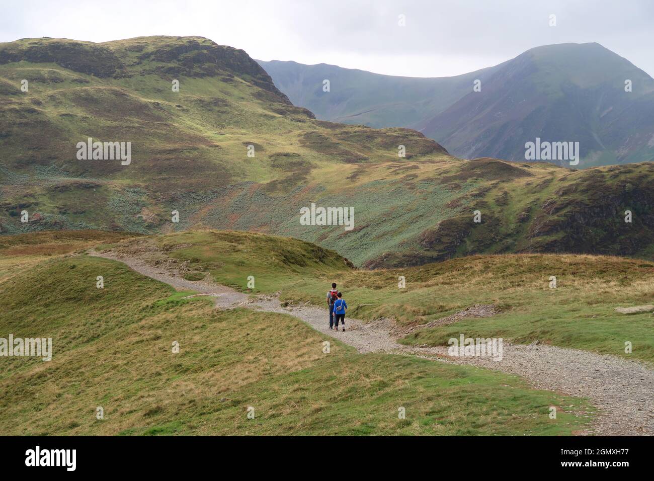 A couple walk on Cat Bells, Lake District, UK. A popular ridge path ...