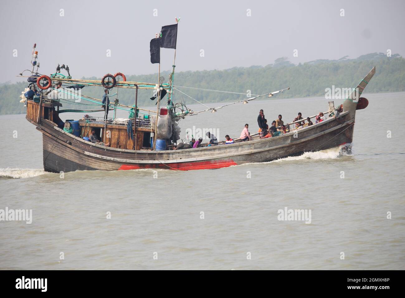 December 16 2019 Barguna, Barisal, Bangladesh. A wooden fishing boat is leaving. Stock Photo