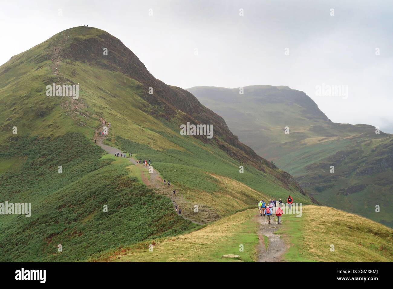 Cat Bells, Lake District, UK. A popular ridge path crowded with walkers ...