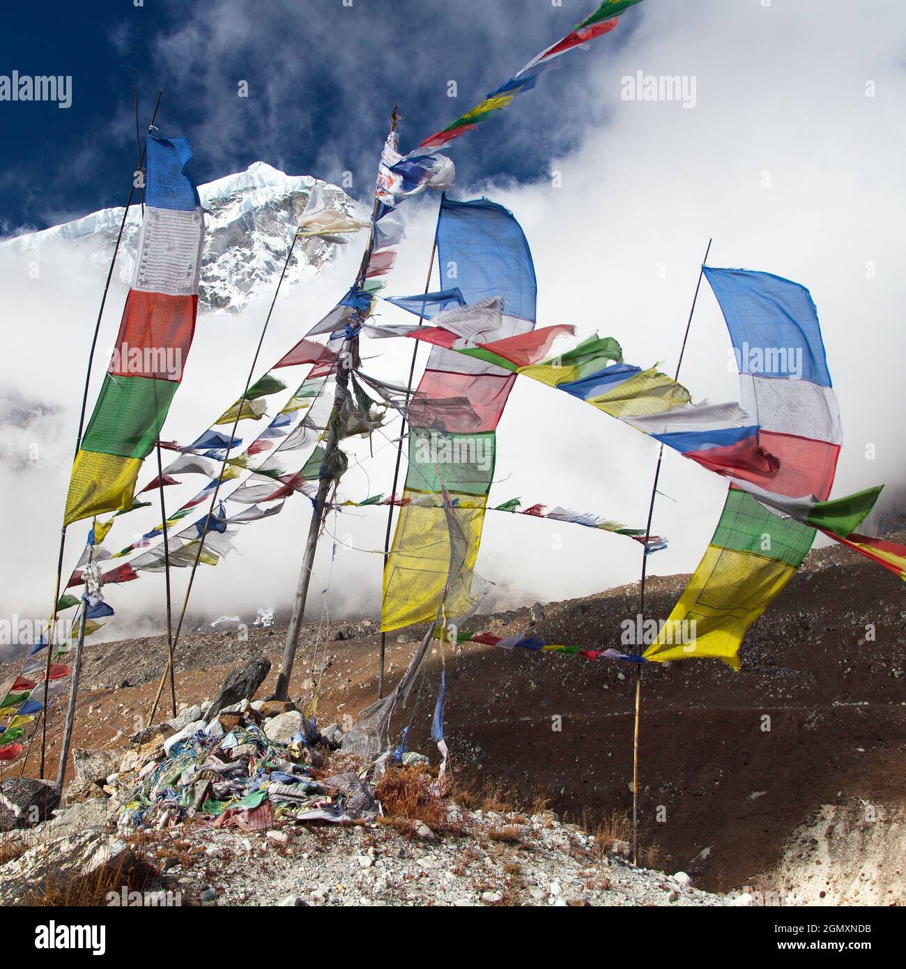 Buddhist prayer flags and Peak seven 7 VII, Maklu barun national park, Nepal Himalayas mountains Stock Photo