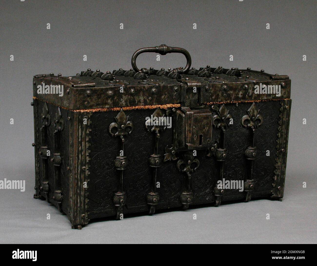 Coffer with key. Date: 16th century; Culture: French; Medium: Iron, leather, oak; Dimensions: Coffer 8 1/2 x 14 1/2 x 8 1/4 in. (21.6 x 36.8 x 21.0 Stock Photo