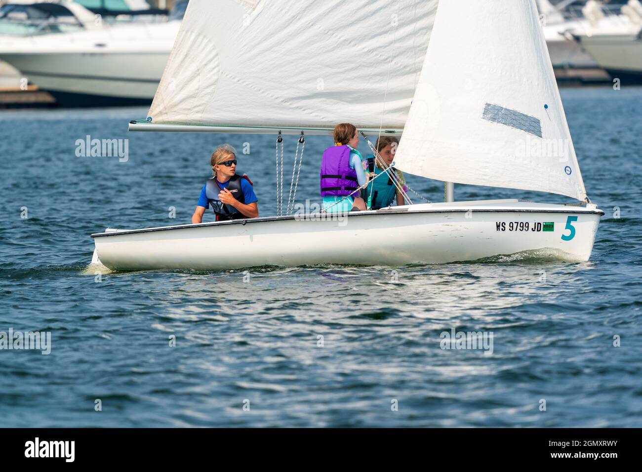 The sail training foundation holds youth sail training classes Fridays from May through October, in the channel between Lake Michigan and Green Bay. Stock Photo