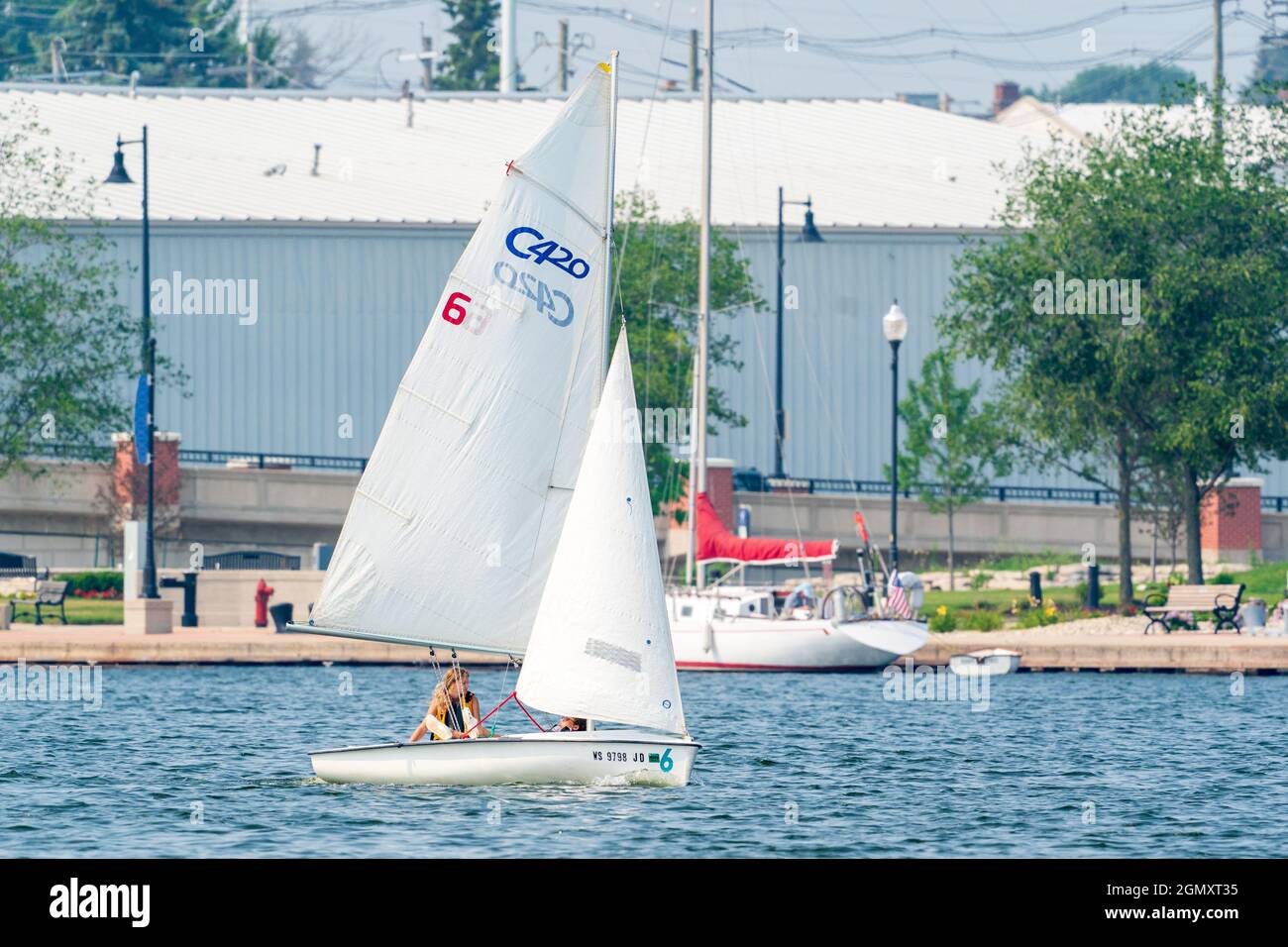 The sail training foundation holds youth sail training classes Fridays from May through October, in the channel between Lake Michigan and Green Bay. Stock Photo