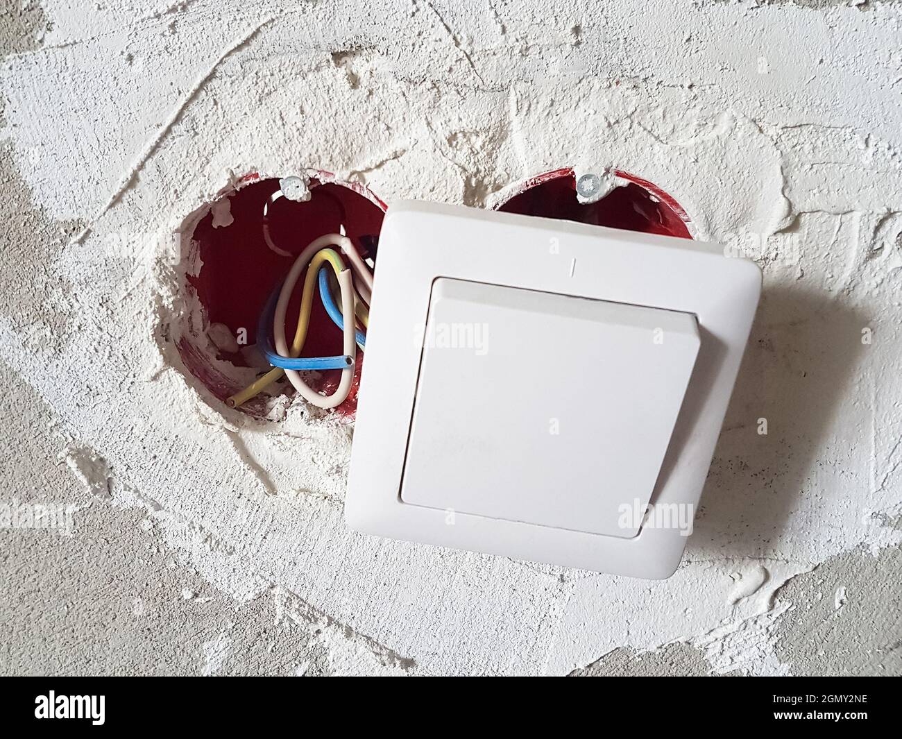 Electrical wires with cables at home repair. New socket on concrete