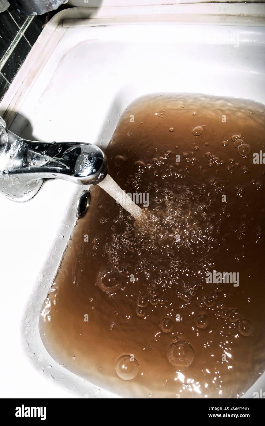 Low quality of tap water. The reason why it makes sense to install tap water filter. Stock Photo