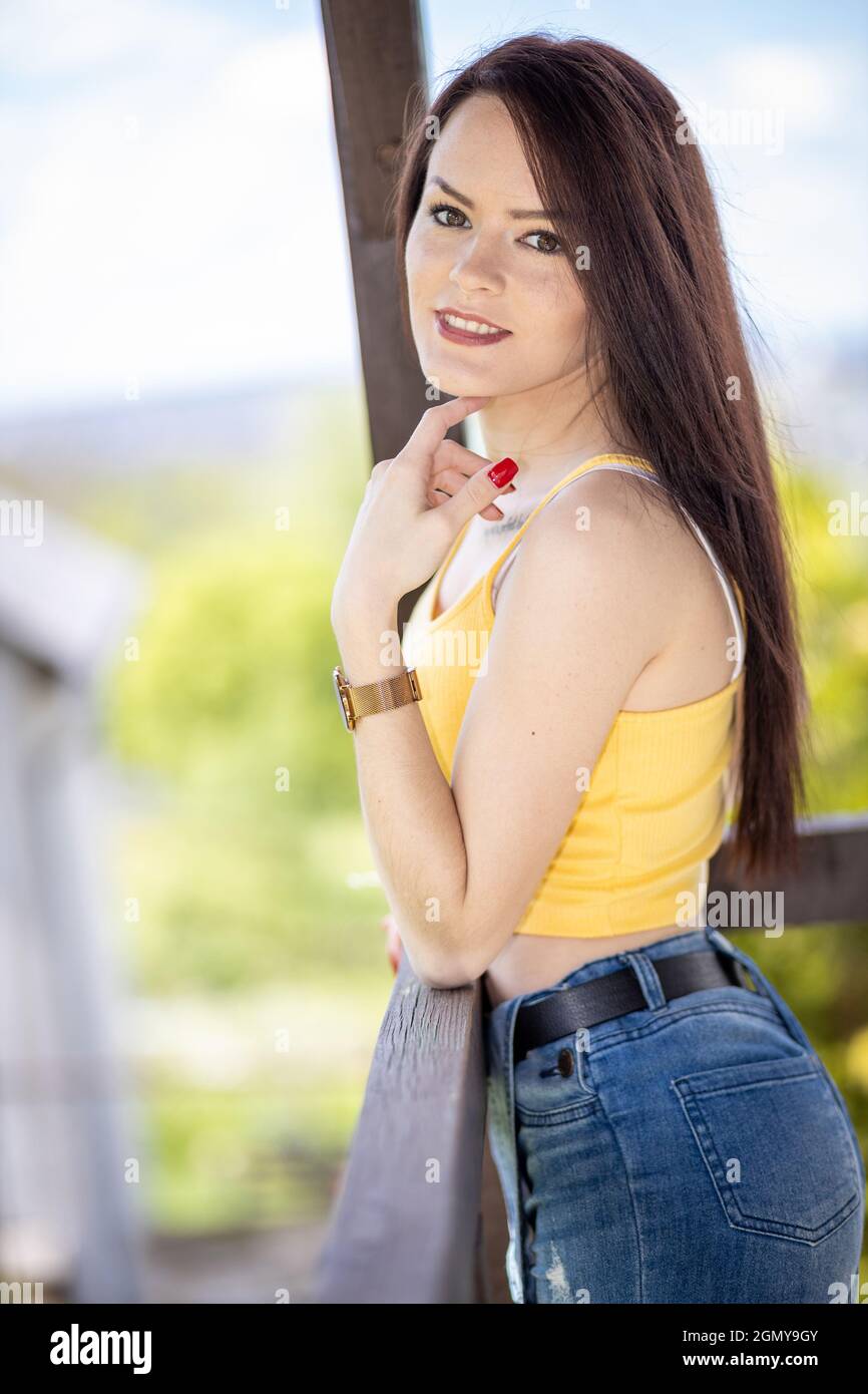Yellow top with blue jeans hi-res stock photography and images - Alamy