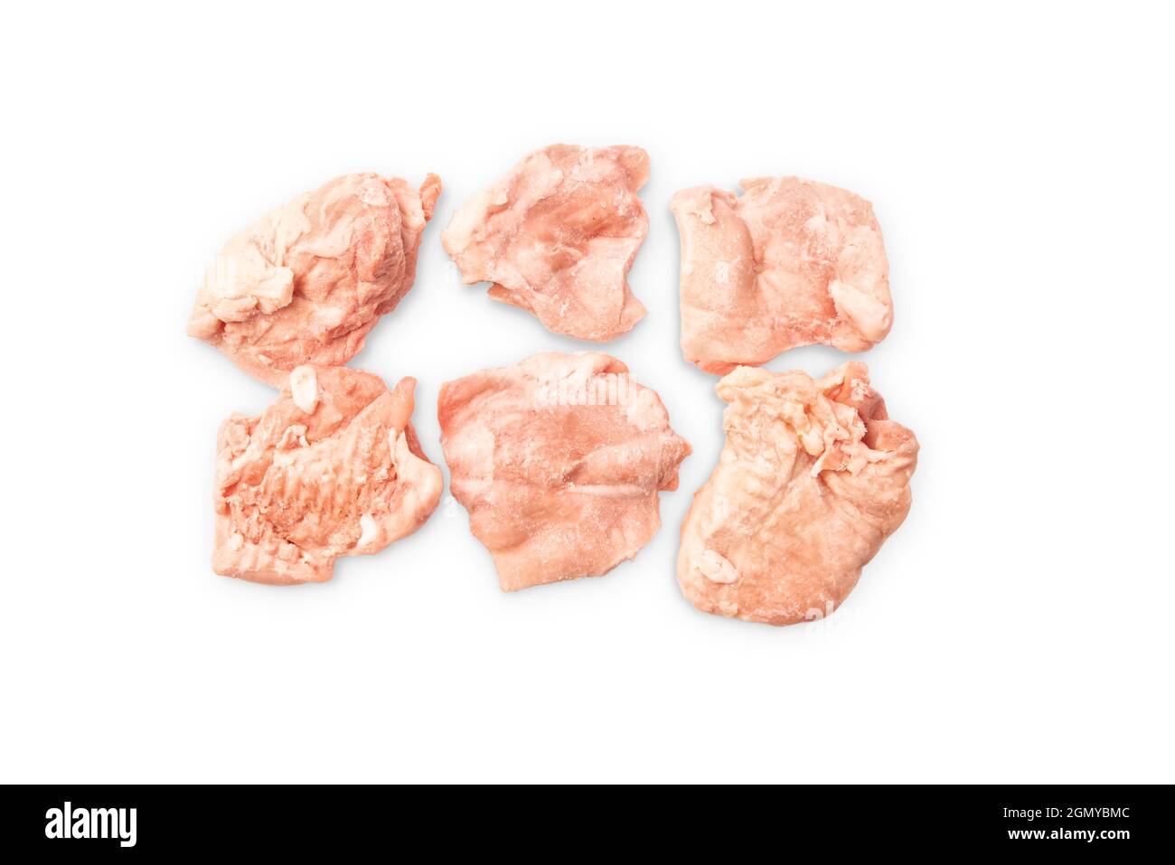 Raw Frozen Skinless boneless Chicken Thigh.Raw chicken thighs on white
