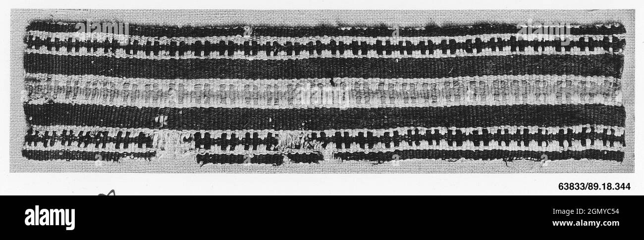 Fragment. Date: 3rd-4th century; Geography: Made in Egypt; Medium: Wool, linen; plain weave, tapestry weave; Dimensions: 13 in. high 2 13/16 in. wide Stock Photo
