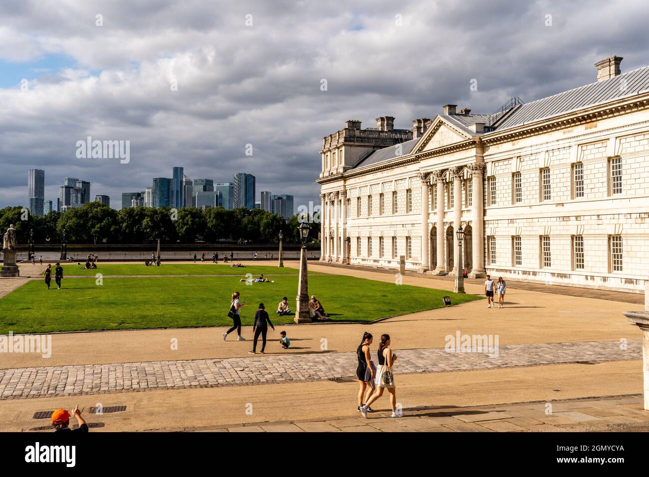 The Old Royal Navy College With Canary Wharf In The Backround, Greenwich, London, UK. Stock Photo