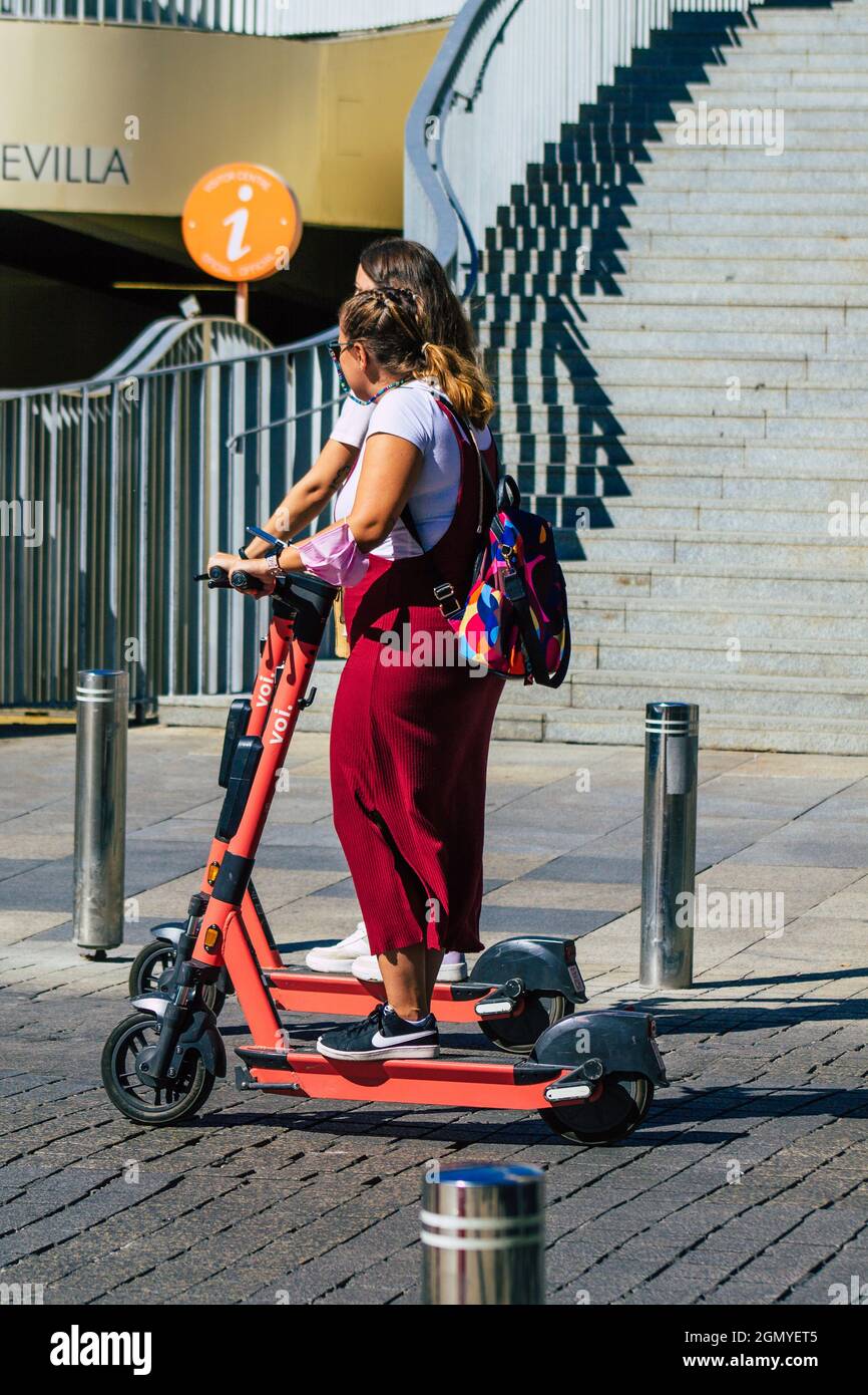 Seville Spain September 18, 2021 People rolling with an electric scooter in  the streets of Seville, operating with a small utility internal combustion  Stock Photo - Alamy