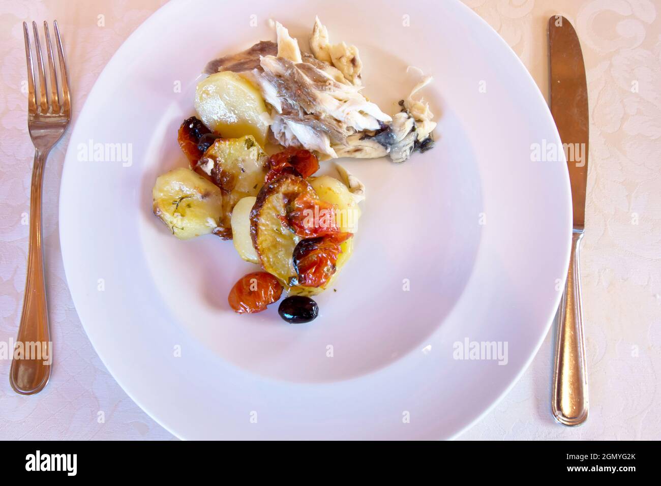 Food, Croaker with Potatoes Olives and Cherry Tomatoes, Senigallia, Ancona, Marche; Italy, Europe Stock Photo