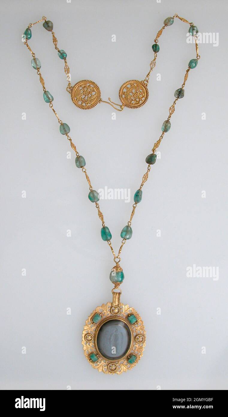 Necklace. Date: 6th-8th century; Culture: Byzantine (?); Medium: Gold, emeralds & agate intaglio; Dimensions: Overall: 15 11/16 x 1 7/8 x 3/16 in. Stock Photo